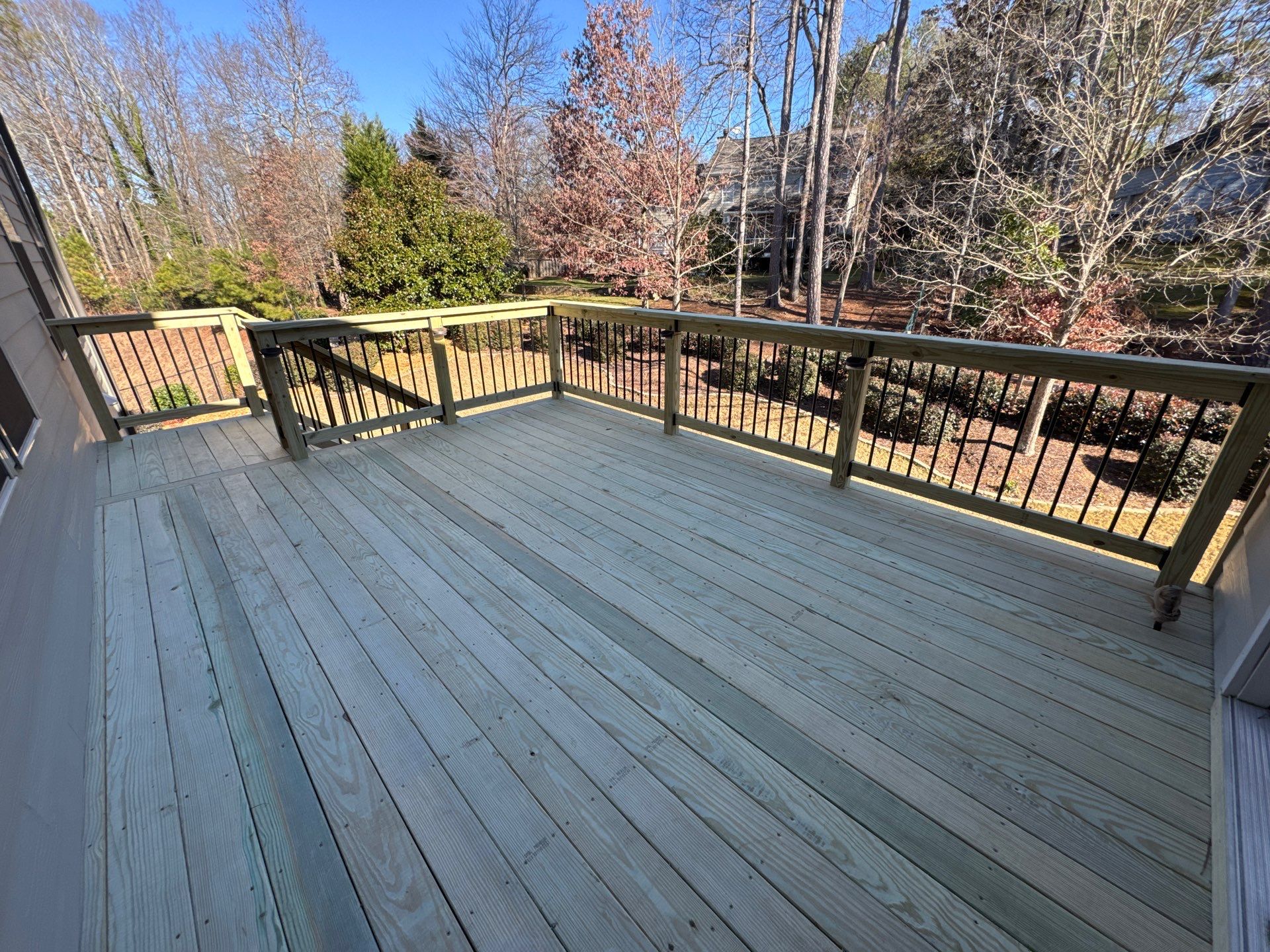 Custom Pressure-Treated Deck with Metal Balusters in Marietta by Swift Home Renovations