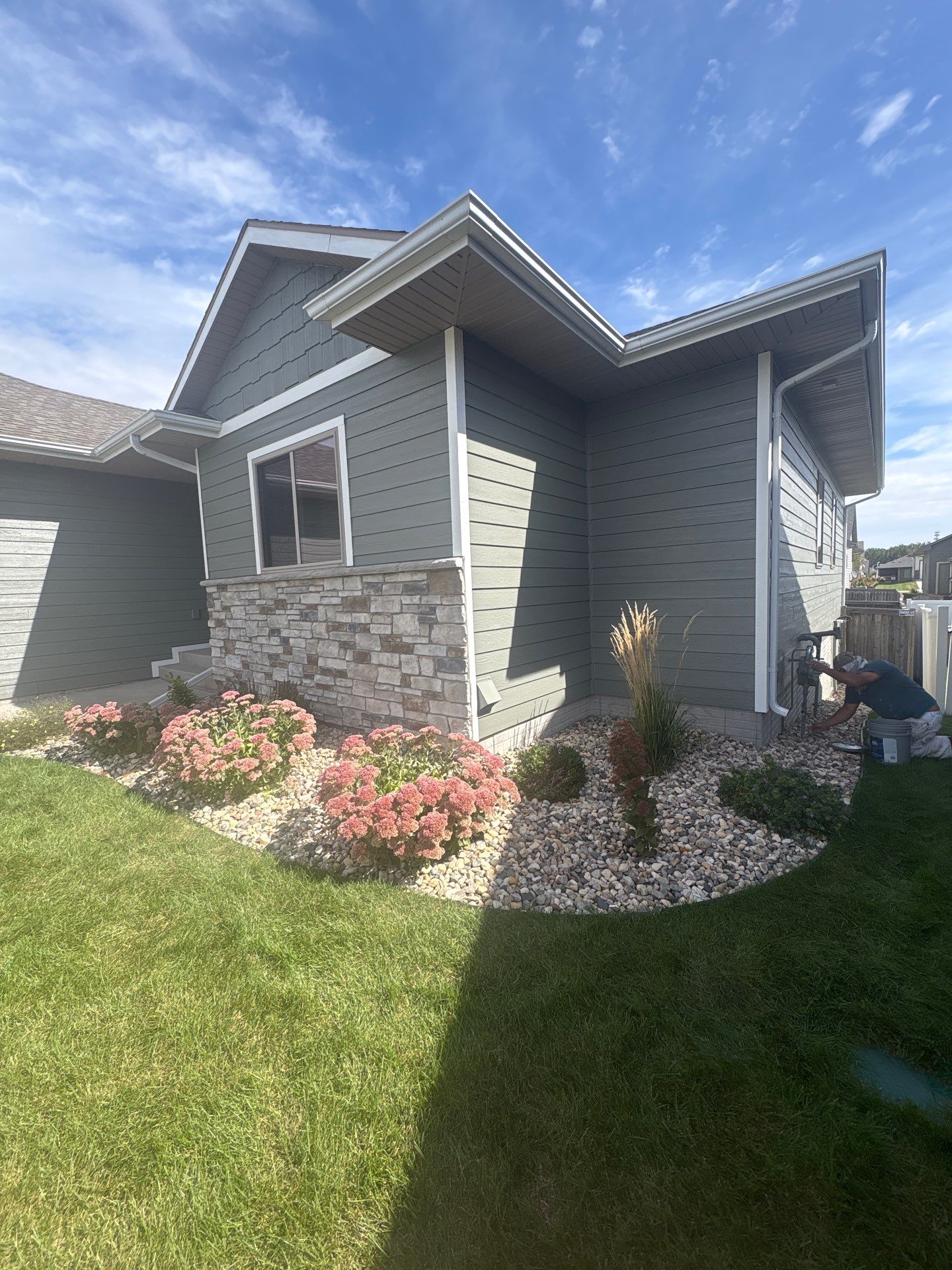 Full Exterior Home Painting on Blue Lap Siding in Sioux Falls by Select Painting, Coatings & Garage Cabinets