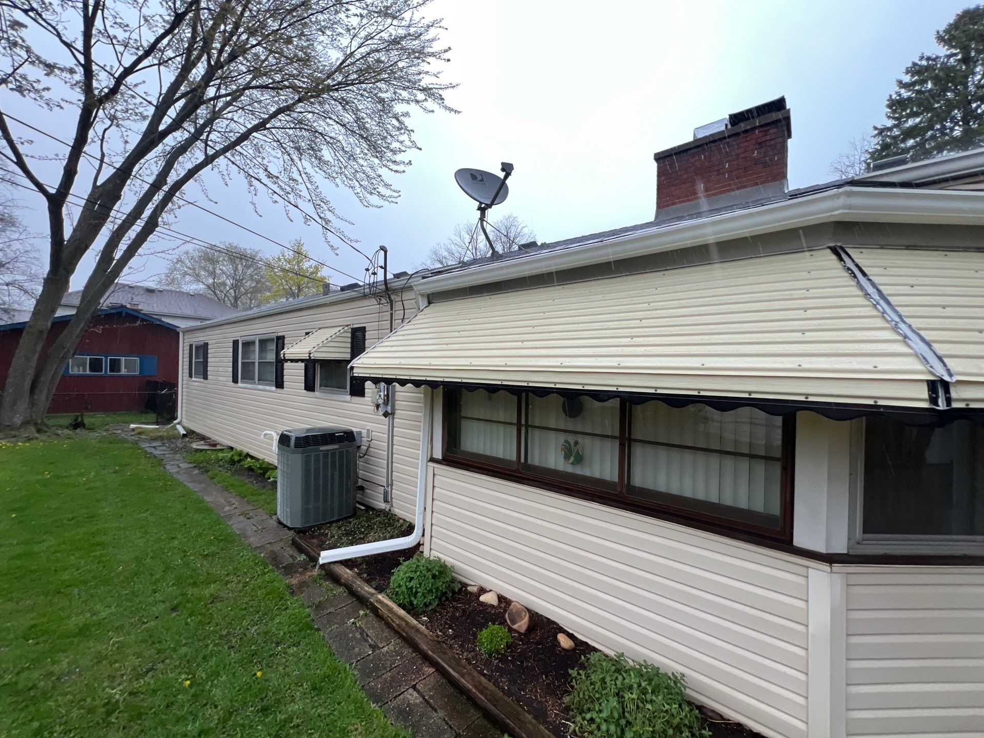 Housewashing  using Algaecide, soft wash soap by Northern Power Washing LLC.
