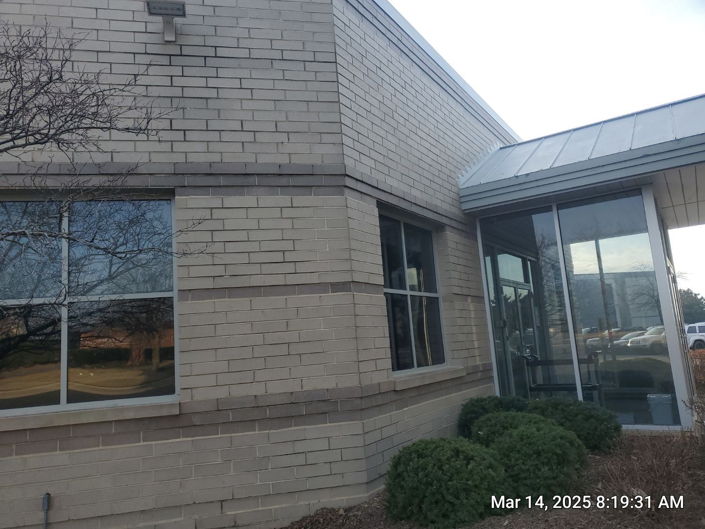 Commercial Facade cleaning using Algaecide, soft wash soap by Northern Power Washing LLC.