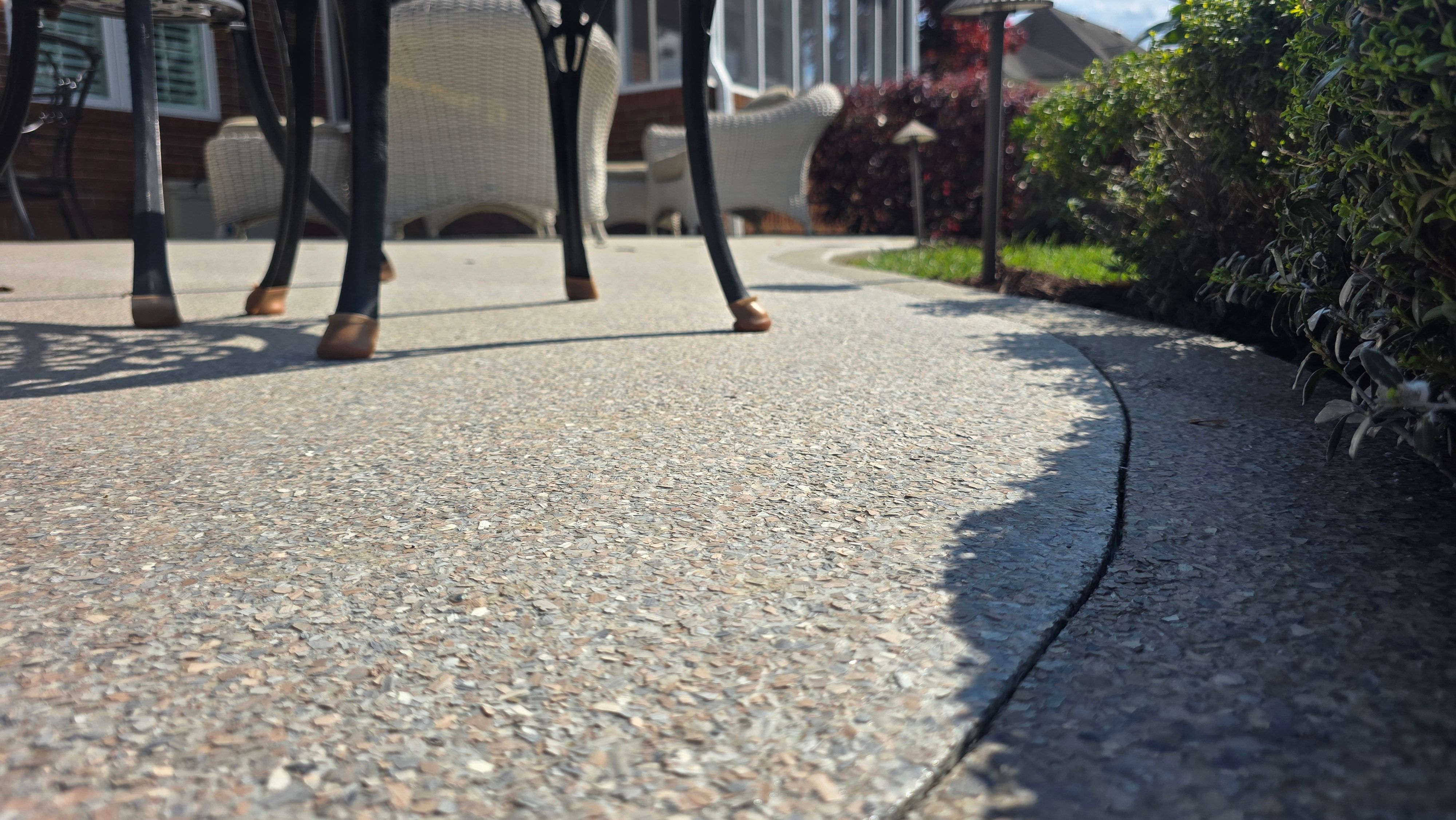Patio in Pumice with Obsidian Border  by Elite Floor Solutions
