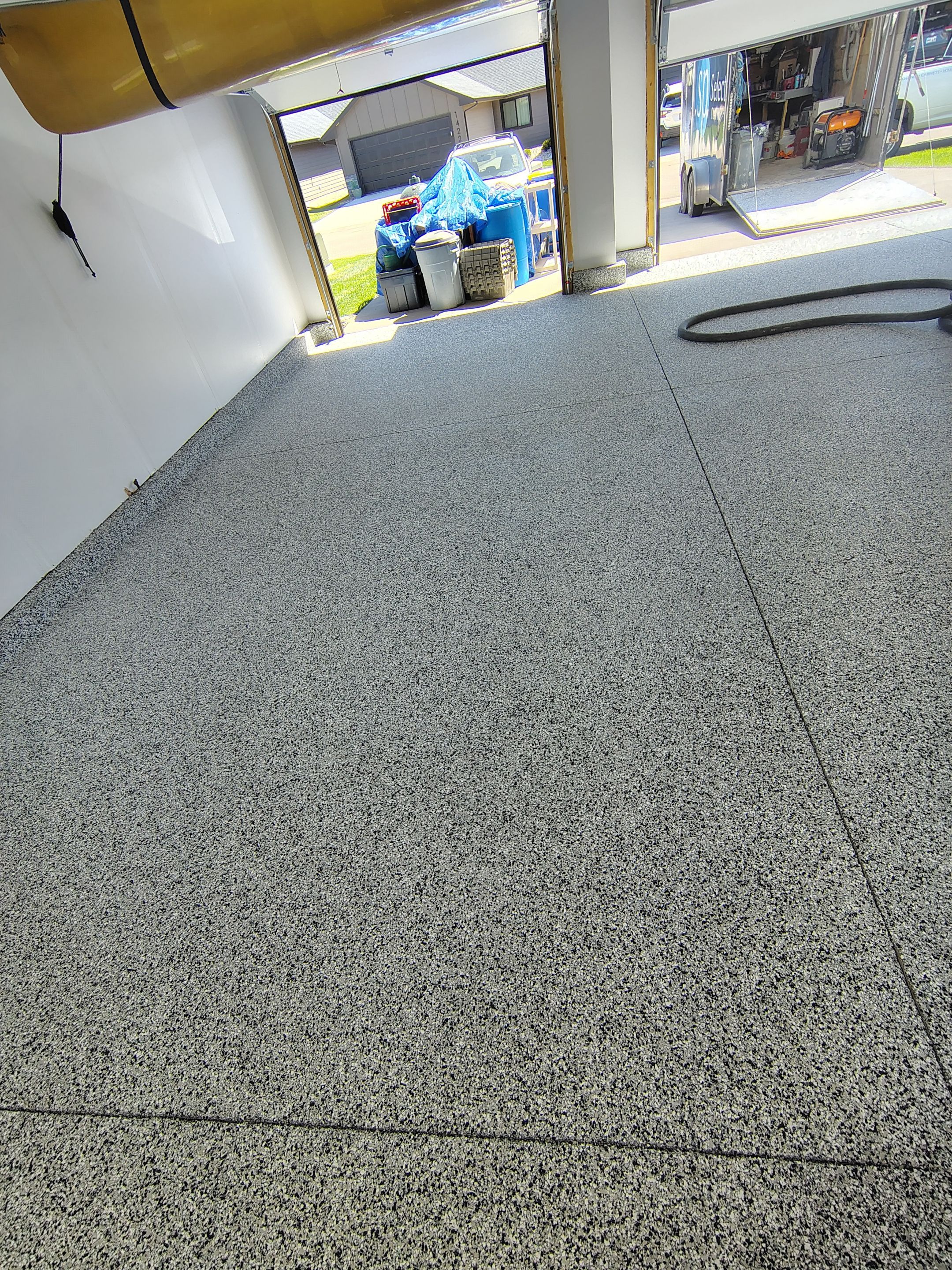 Decorative Flake Garage Floor Coating Installation in Tea, South Dakota by Select Painting, Coatings & Garage Cabinets