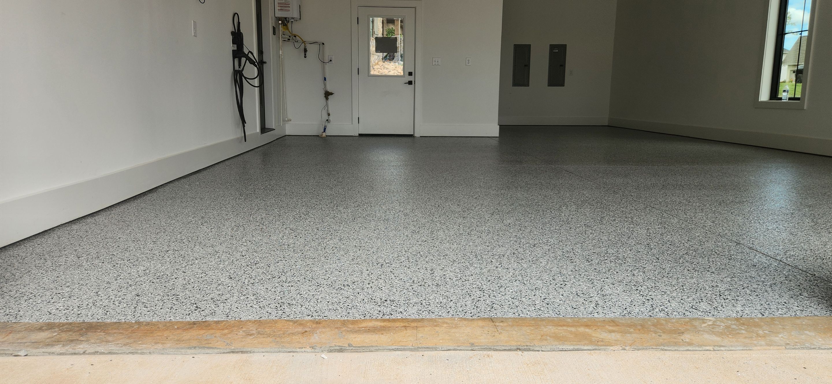 Garage Transformation Using Houndstooth by Elite Floor Solutions