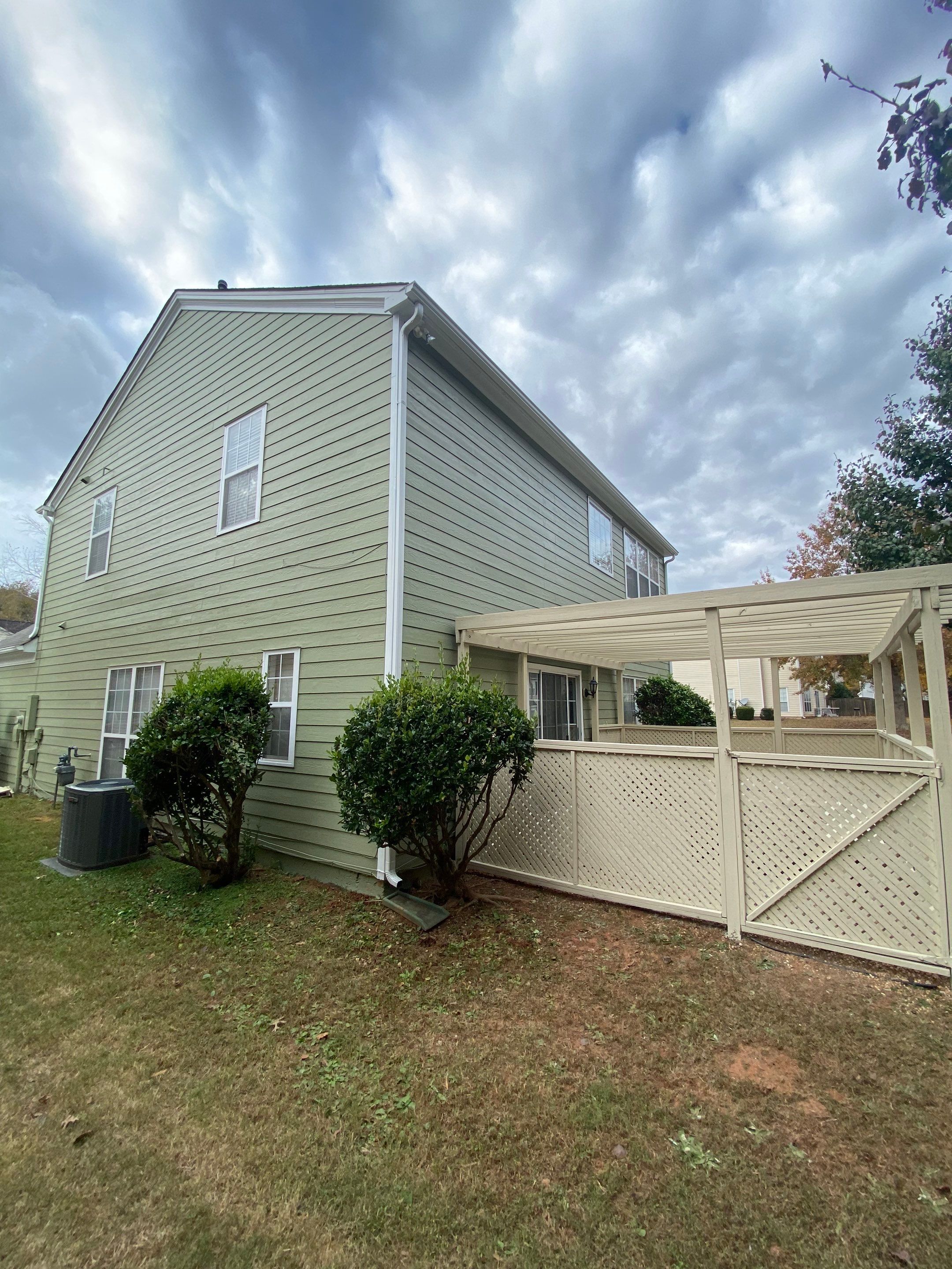 Exterior Painting for a Two-Story Sage Green Home in Kennesaw by Swift Home Renovations