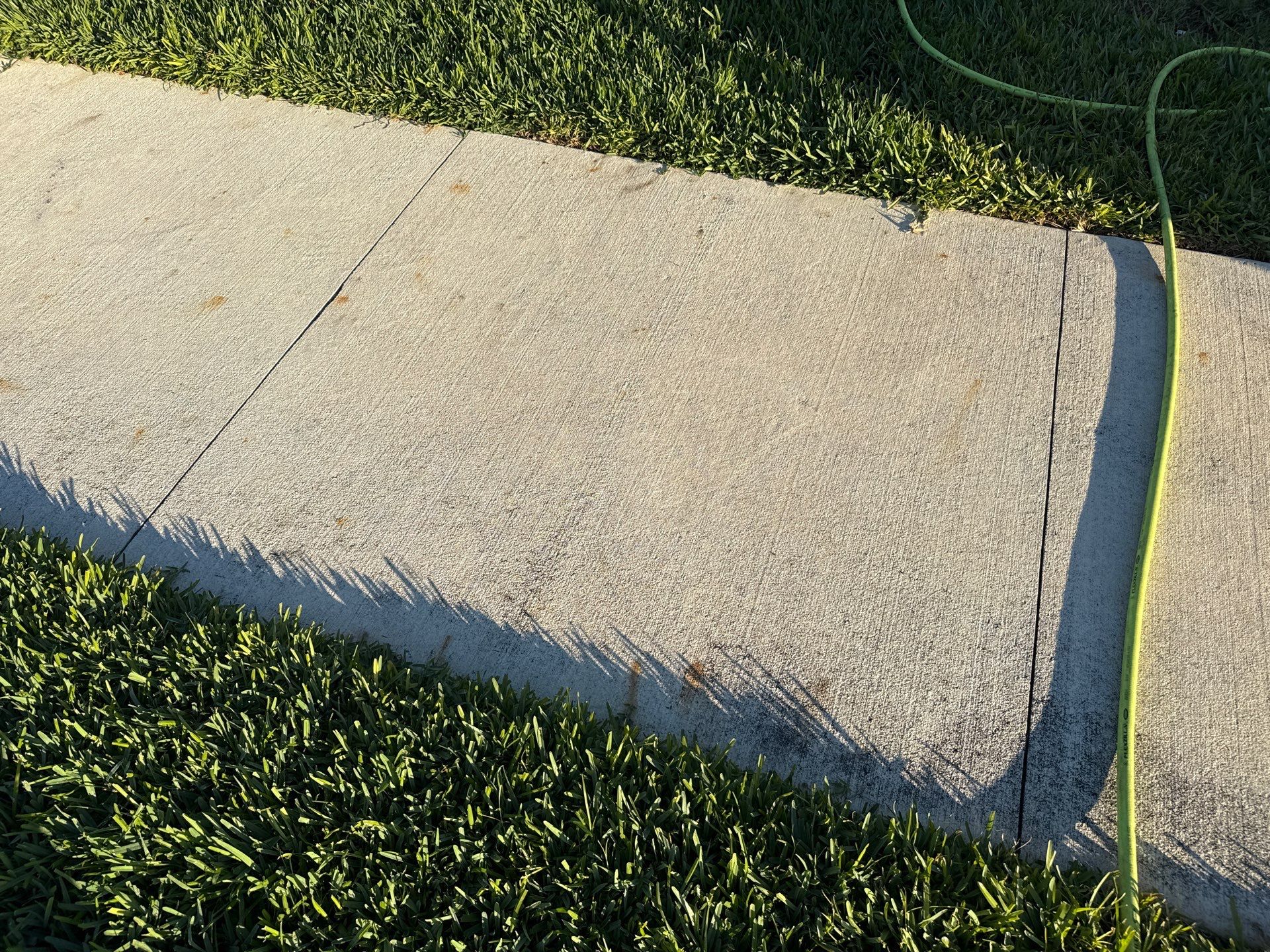 Rust Stain Removal from Concrete Driveway and Pavers in Park East at Azario | Lakewood Ranch, FL by Sunshine AquaWash