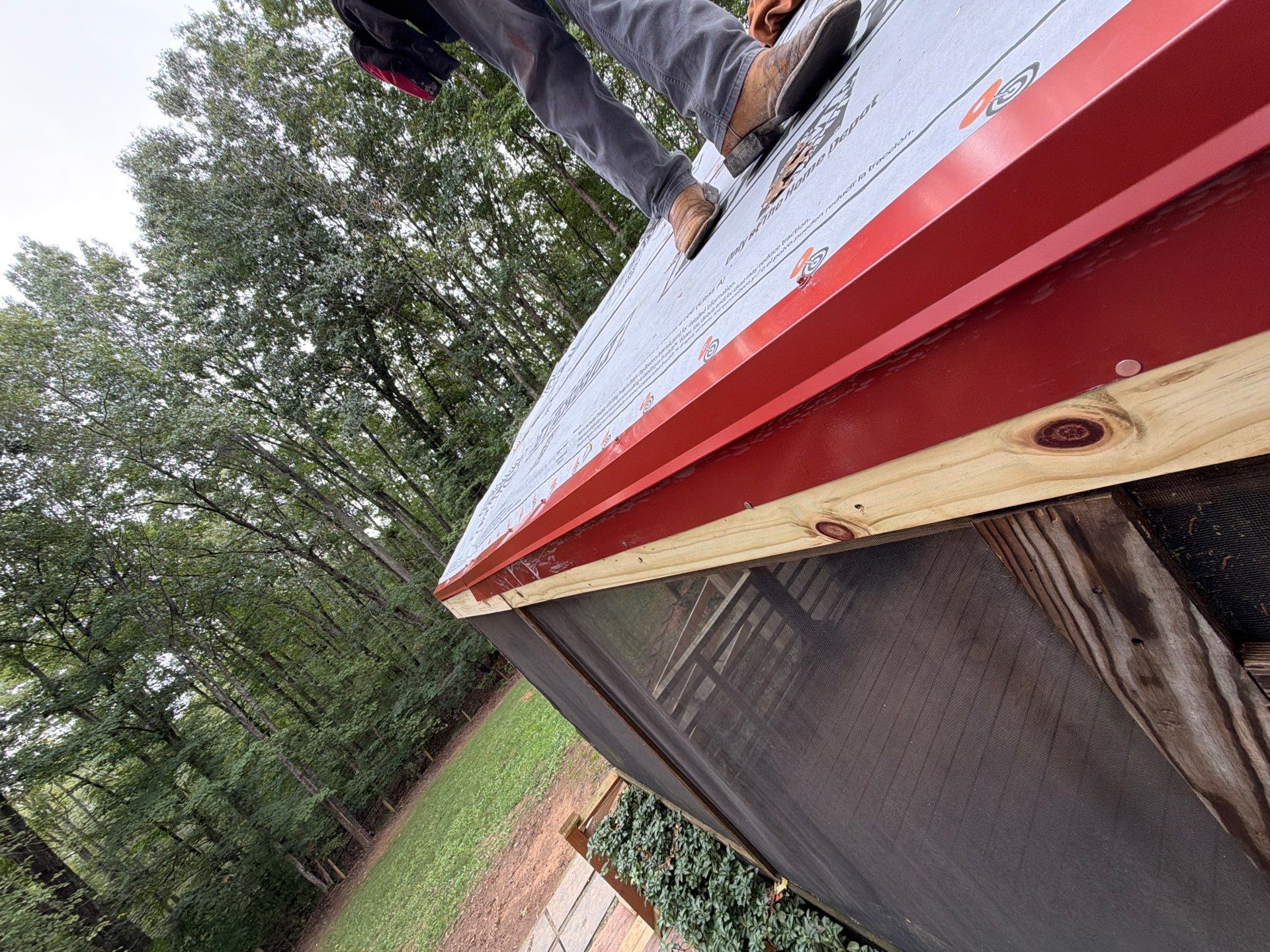 Red Metal Roof Restoration and Wood Fascia Replacement in Barboursville by Cade Construction