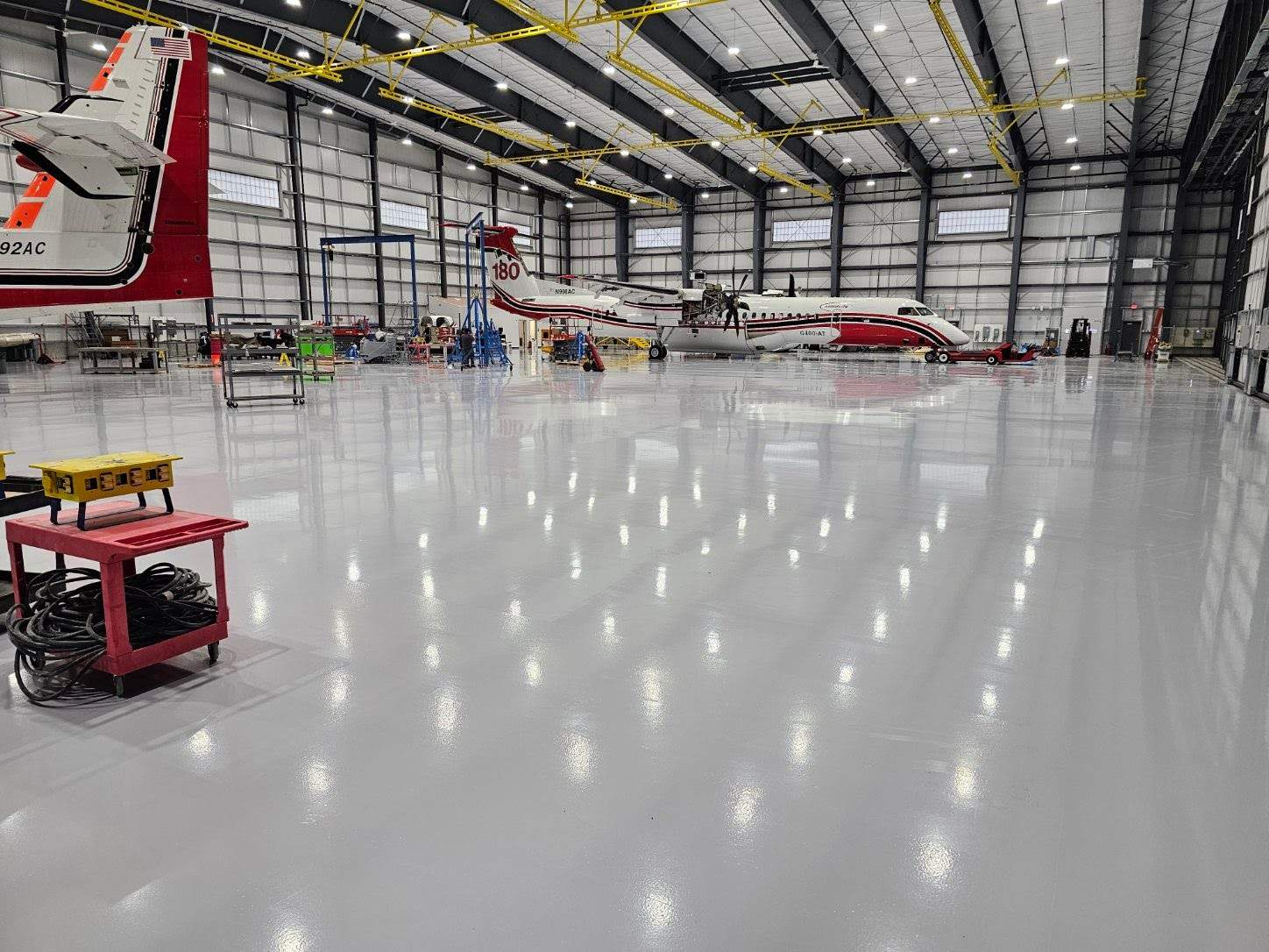 Airplane Hanger using Light Grey Commercial Penntek Epoxy by Croc Coatings, LLC