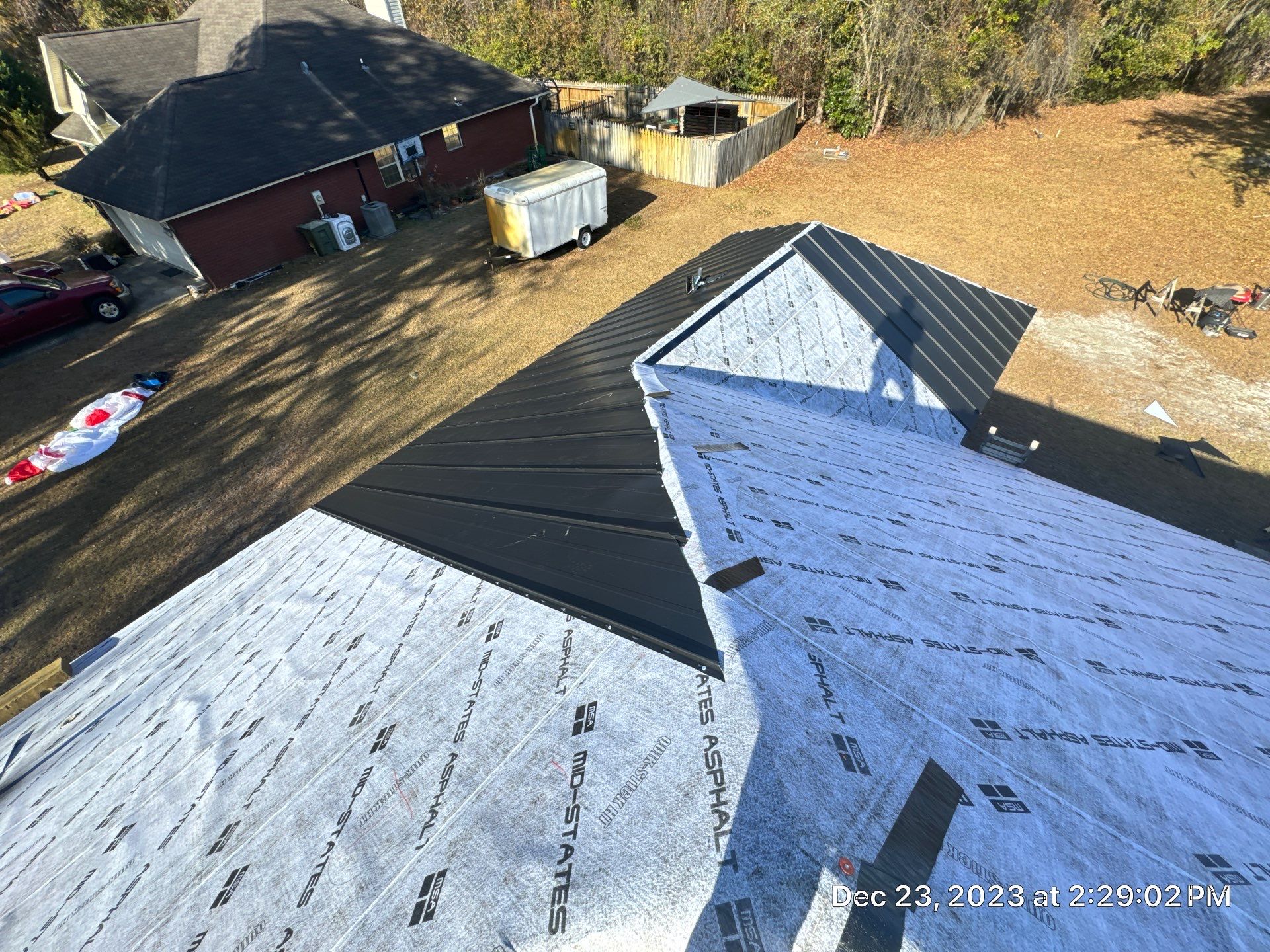 Residential Roofing Installation using Benton 26Ga 1inc Snapcock Metal Roof KYNAR Matte Black by Talya Roofing