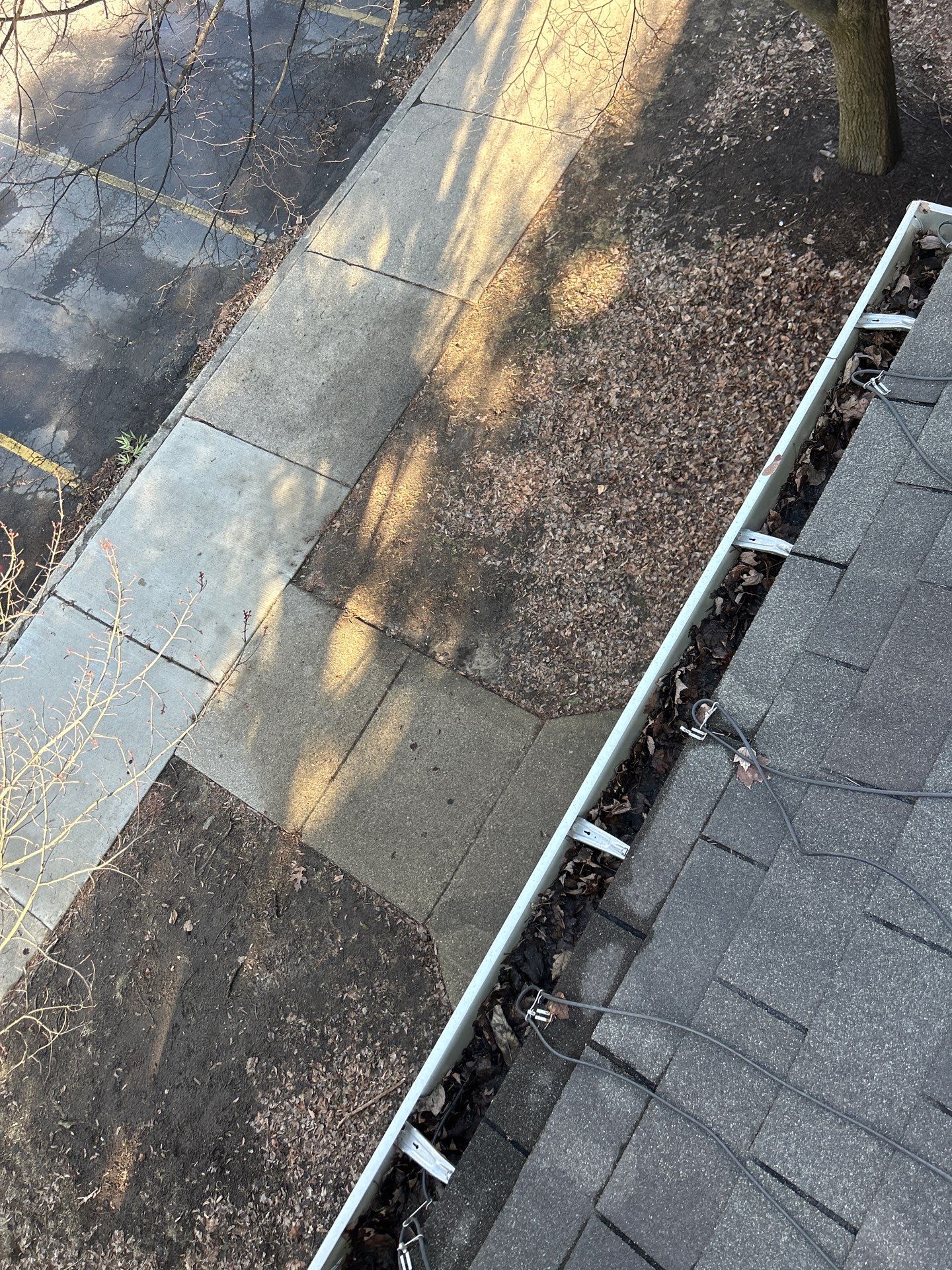 Commercial gutter cleaning Westland, MI before photo with filled gutters