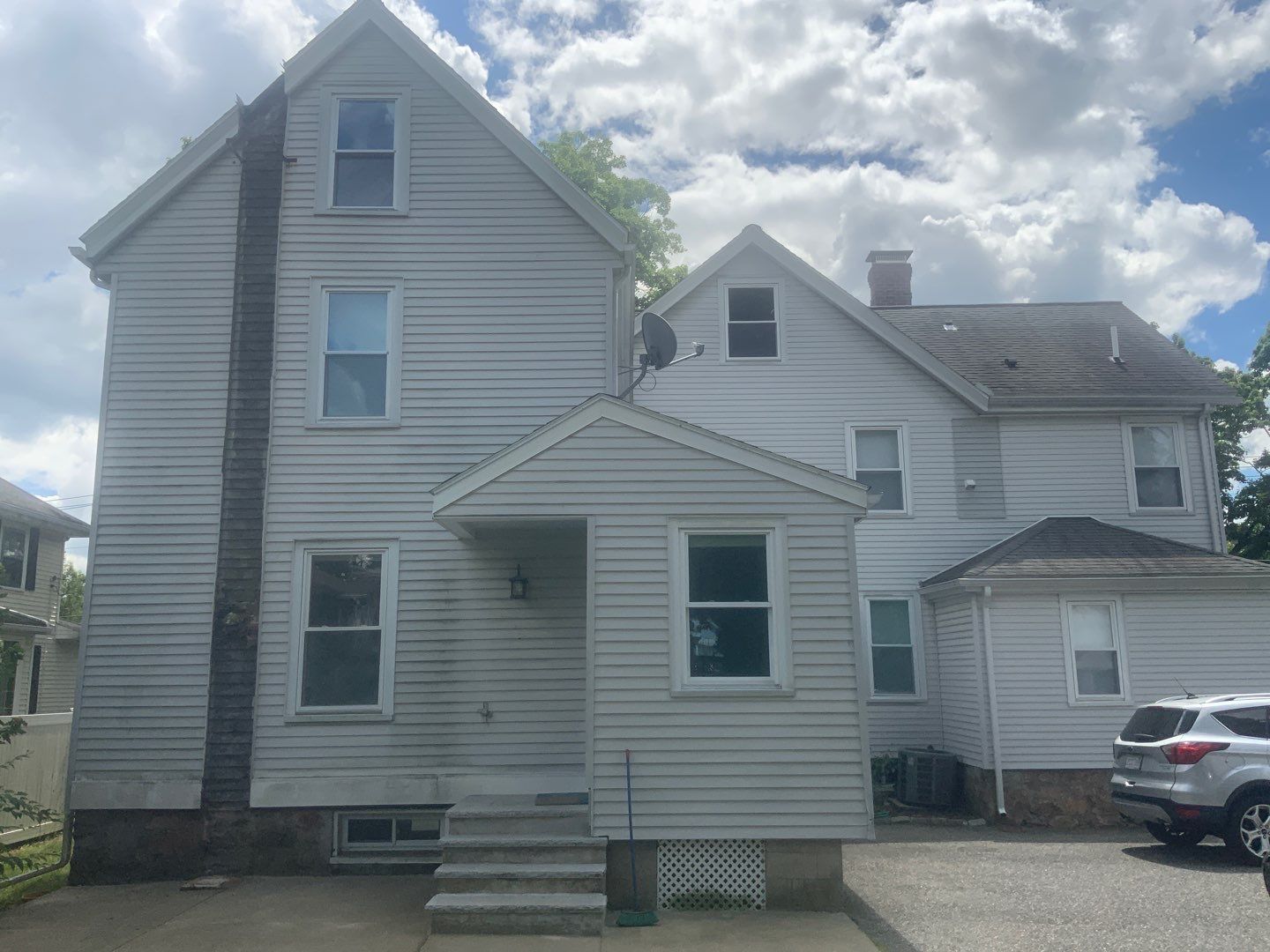 Vinyl siding layover project for 2 family in Wellesley, MA by UBrothers Construction