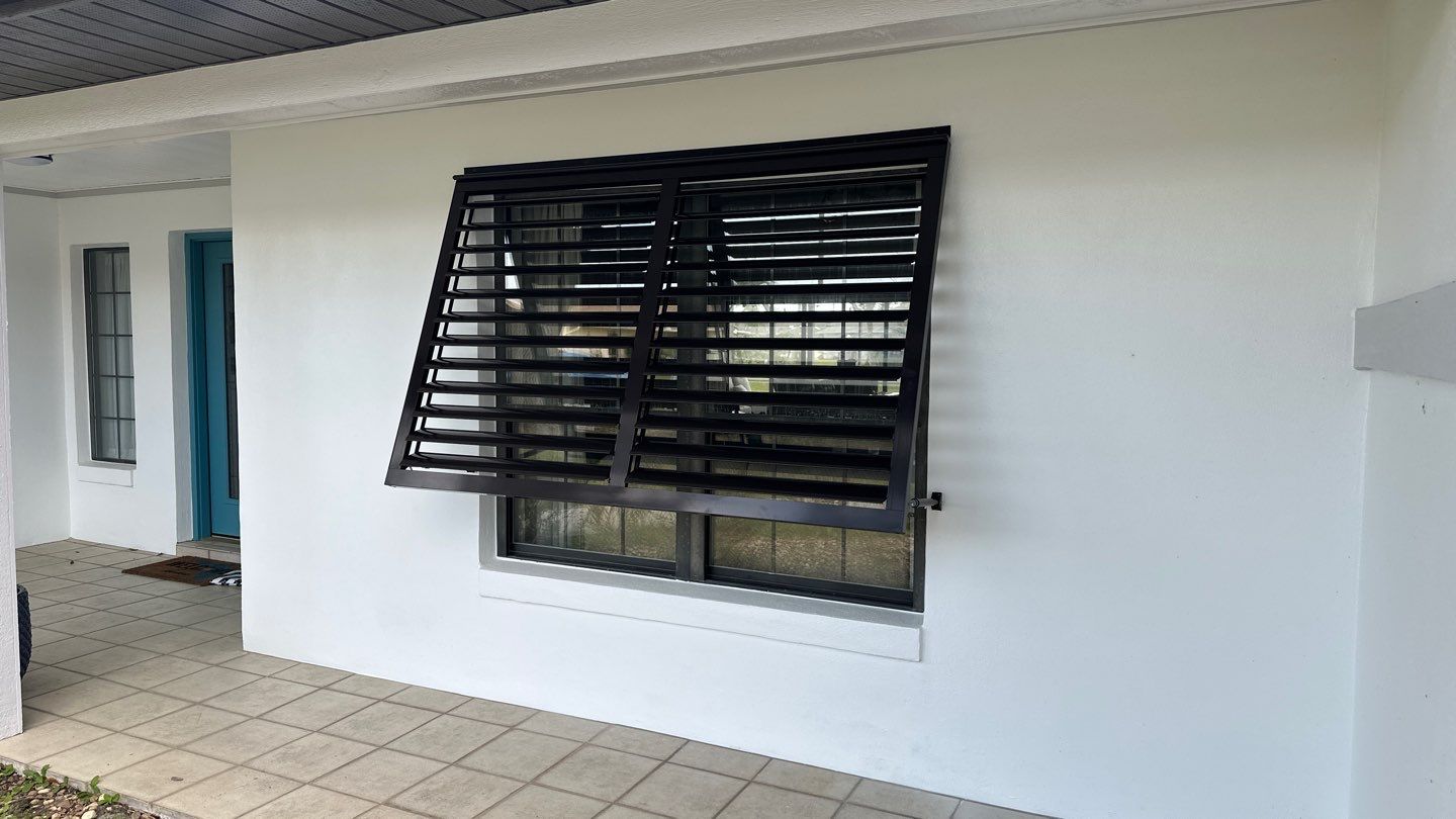 Bahama Shutters in Grey Brown by Smart Guard Shutters