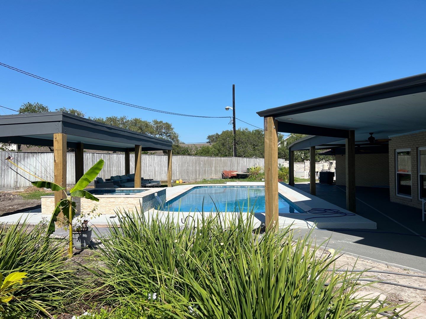 Beautiful pool side build by Bayfront Roofing and Construction