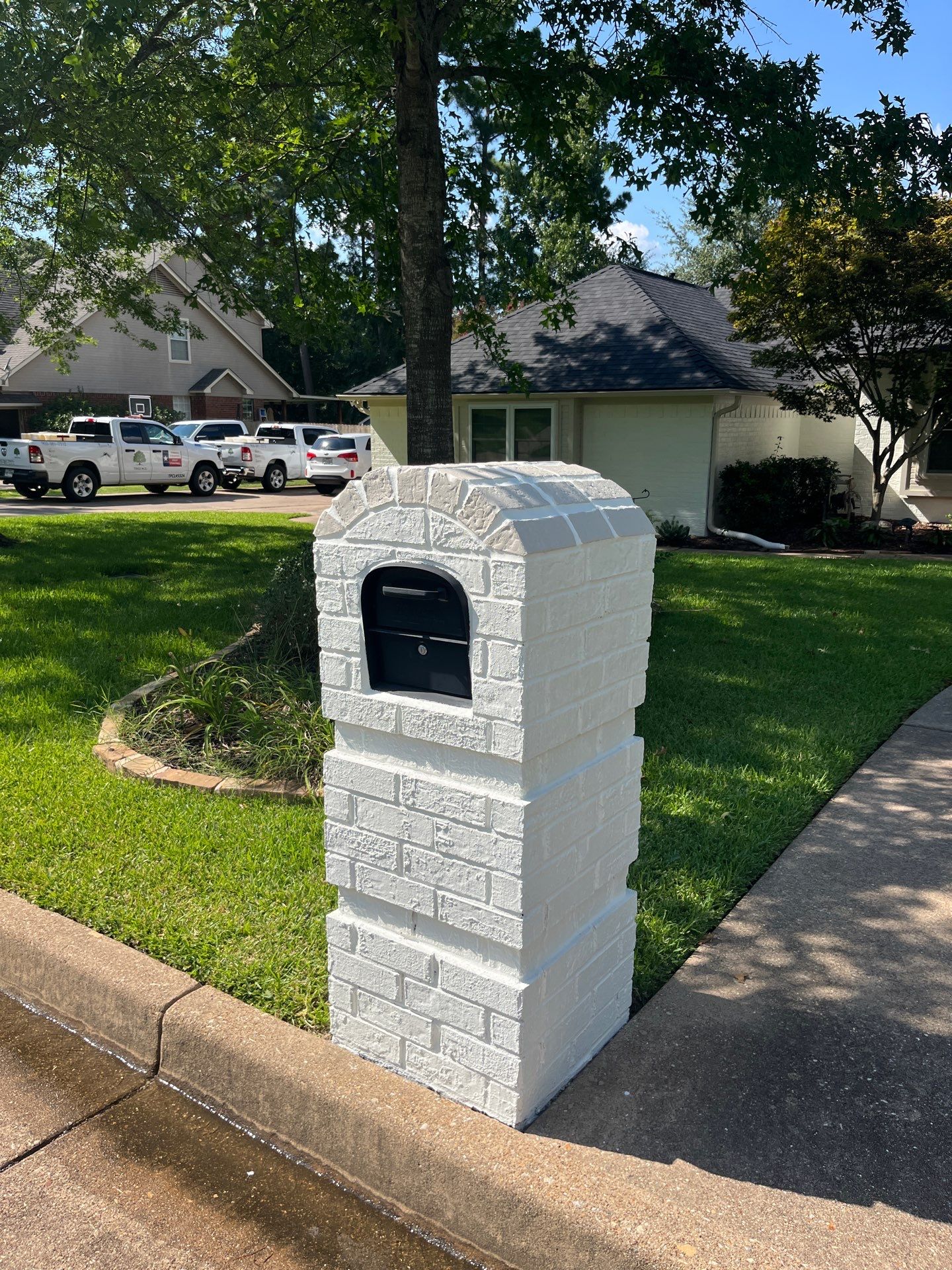 Exterior Painting in Tyler, TX | Brick House with White & Blue Finish by Quality Coats Painting