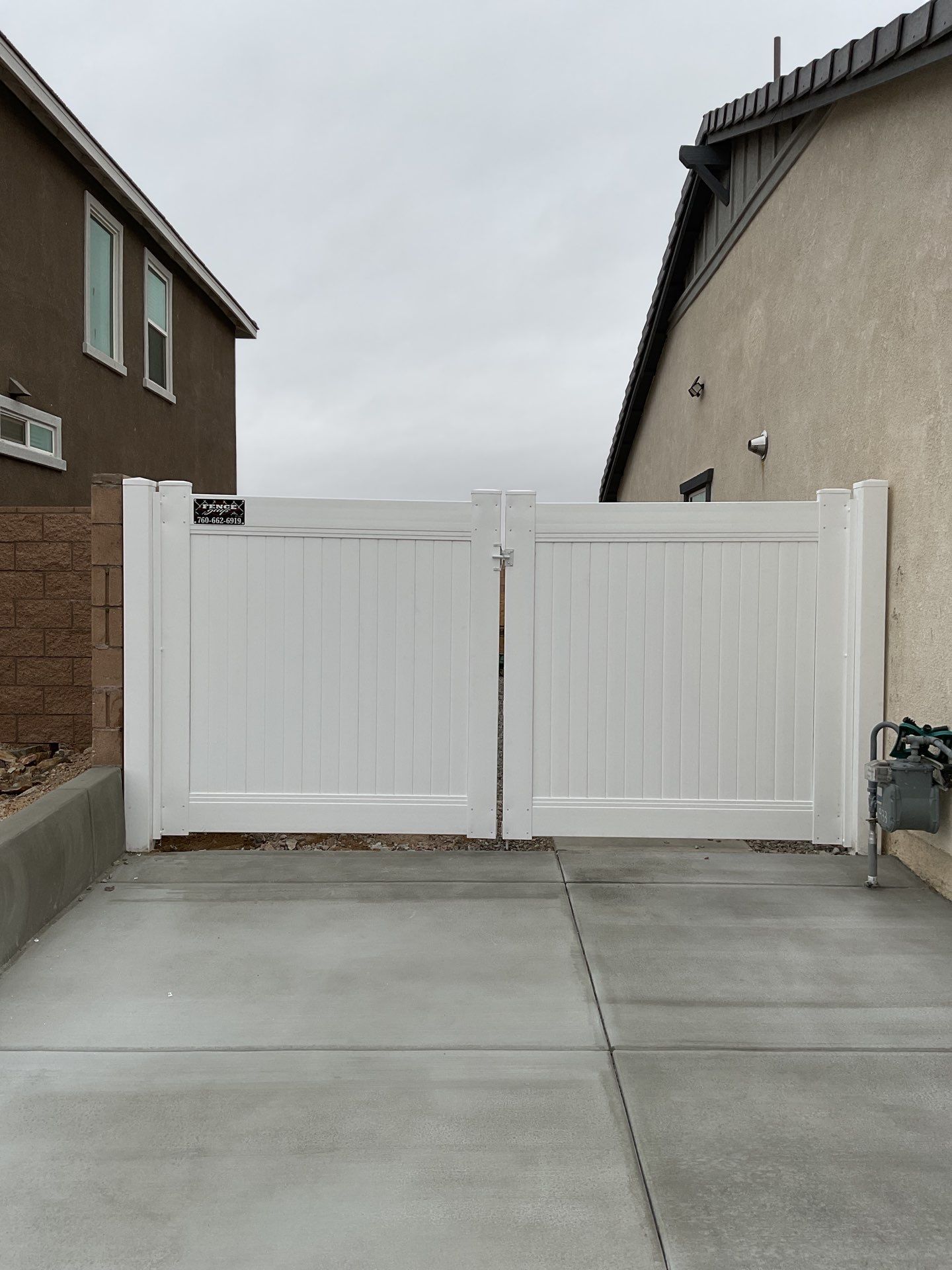 Gate installation using Vinyl by Fence Guys Inc. 