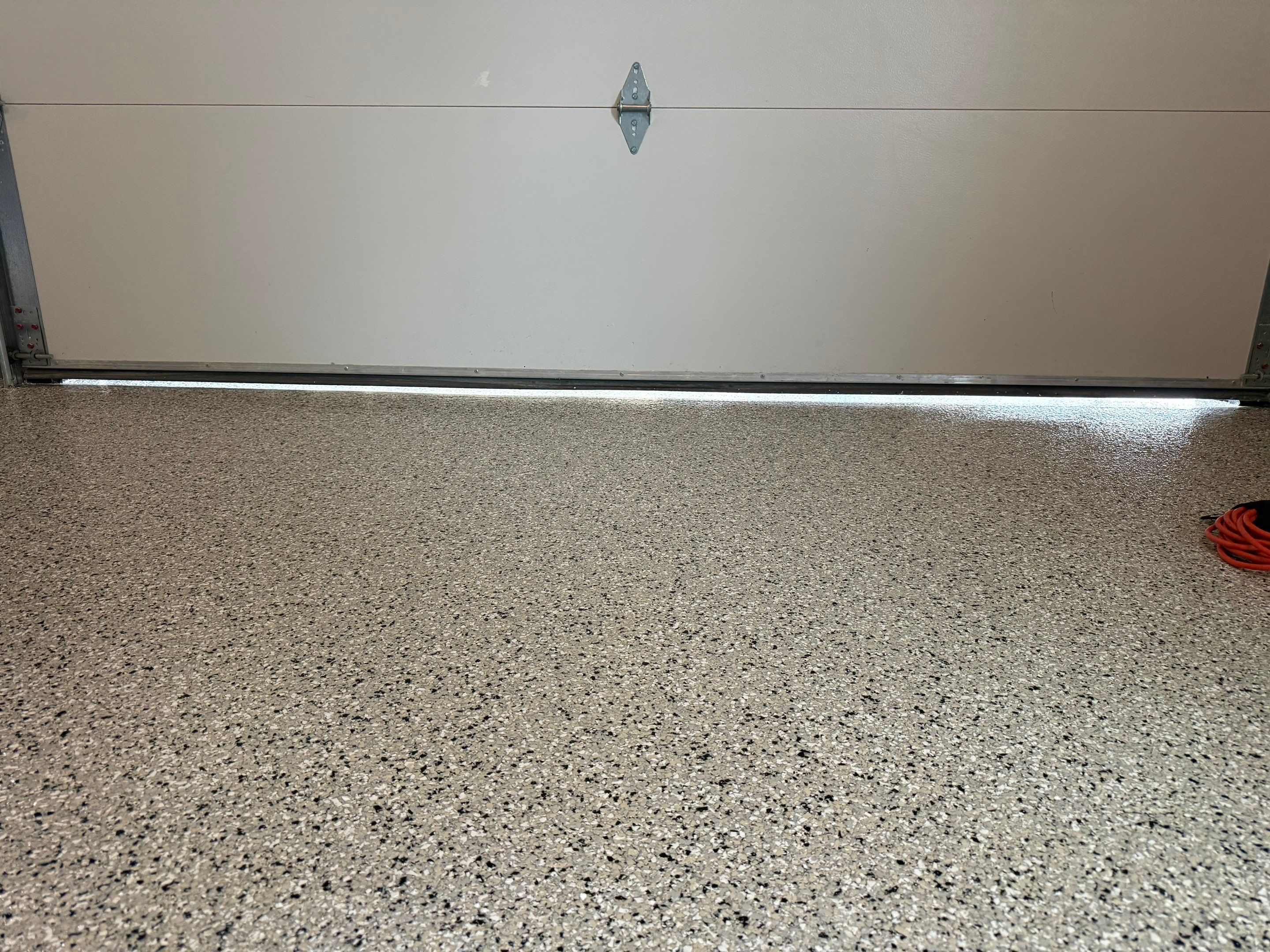 Custom Speckled Concrete Coating for Dell Rapids Garage by Select Painting, Coatings & Garage Cabinets