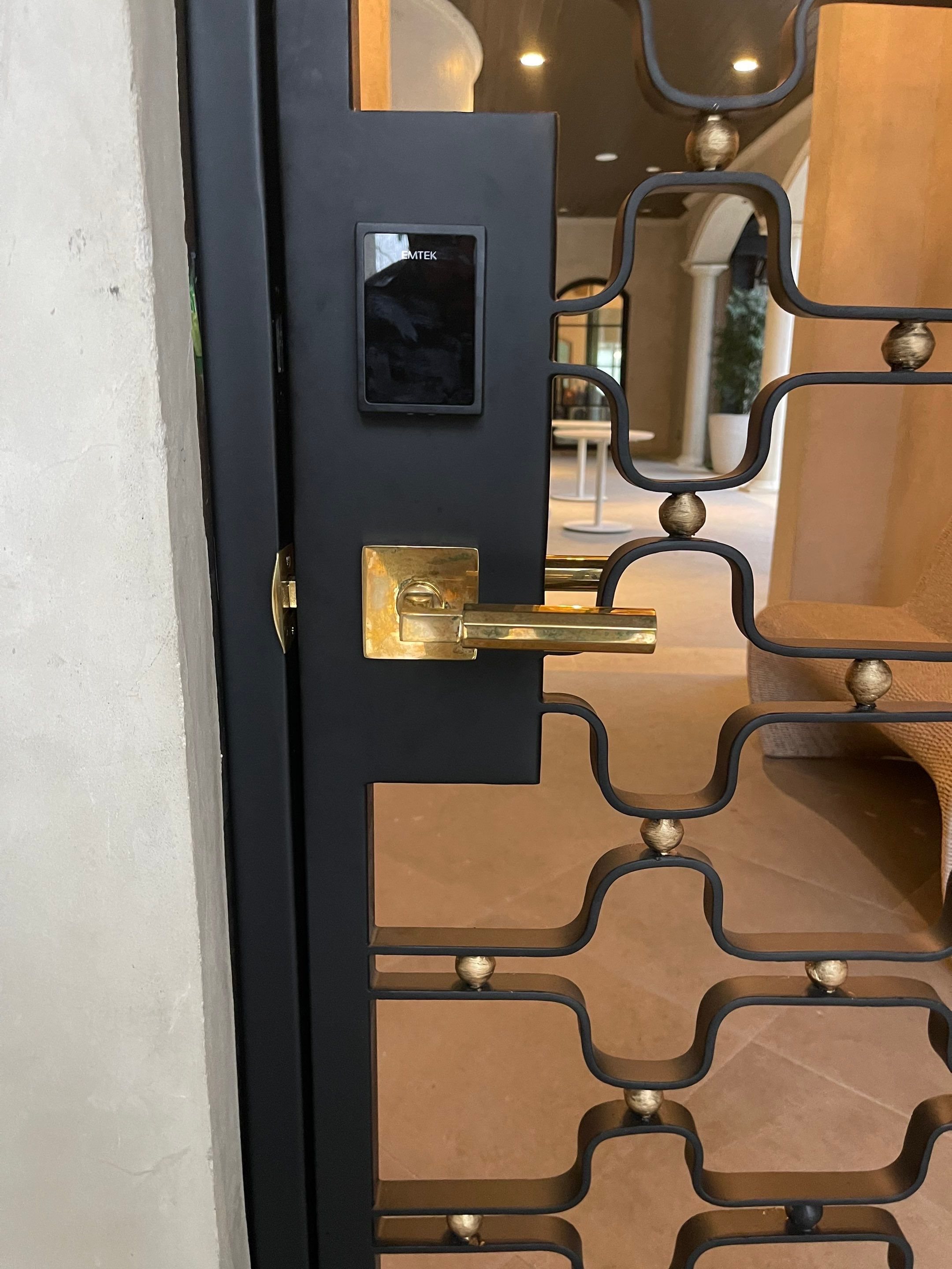 Arched Decorative Metal Security Gate Installation in Dallas by Solara Custom Living