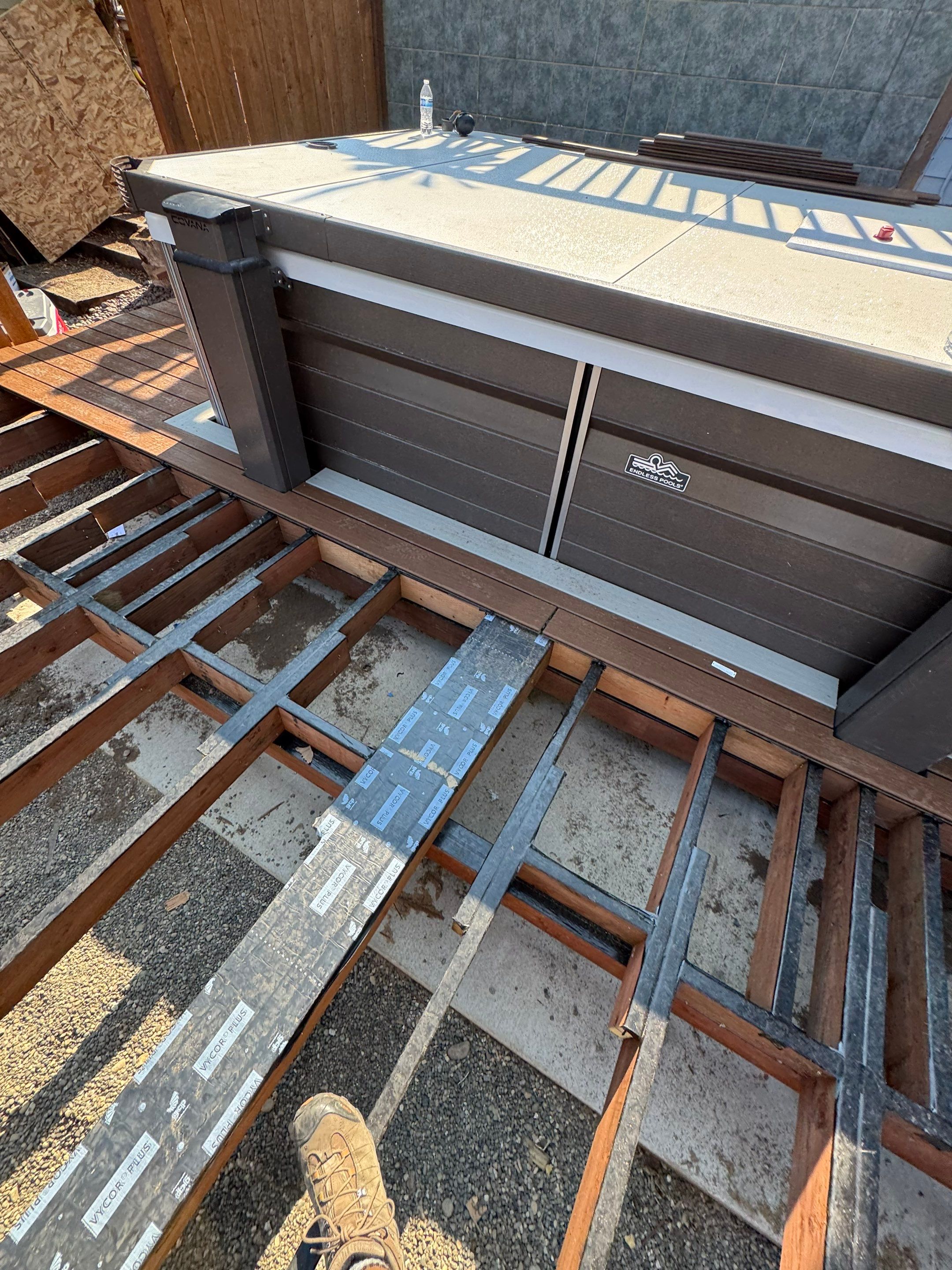 Tacoma Custom Composite Deck and Hot Tub Surround with Retaining Wall by Emerald City Energy 