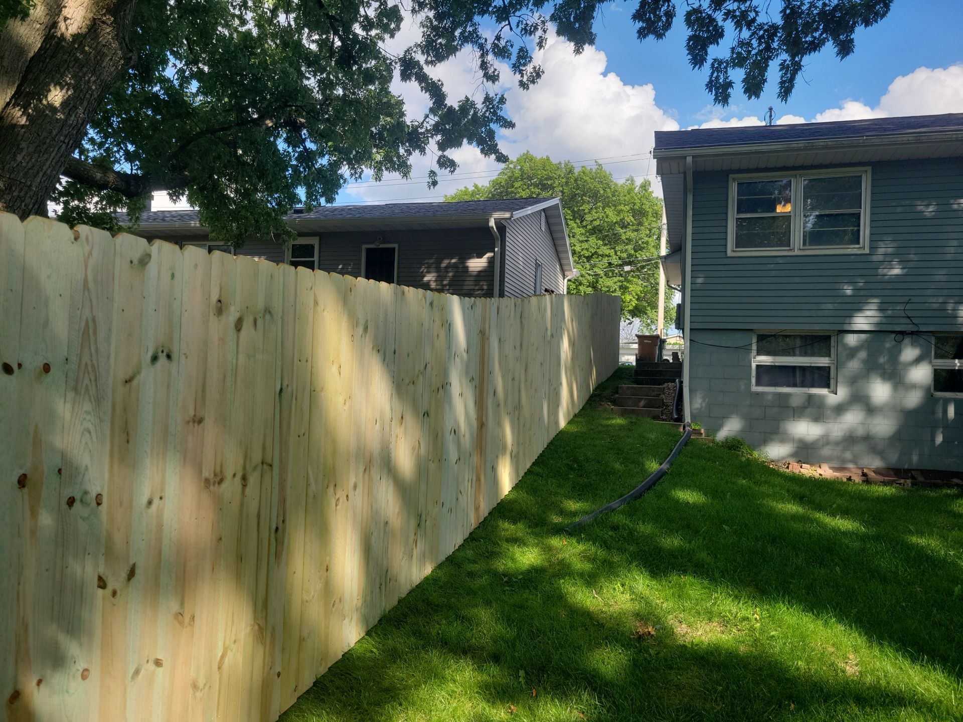 Pressure-Treated Pine Privacy Fence and Custom Gates in Waterloo by Perfect Picket Fence and Stain