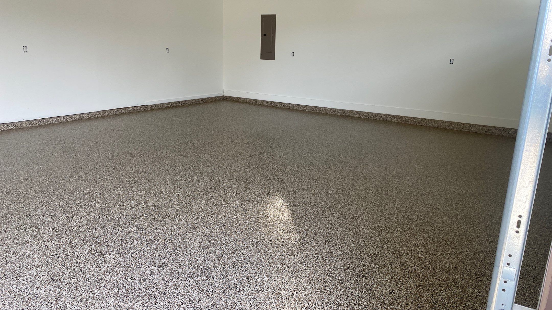 Kenny & Debbie transformed their garage with a Banner Garage Floor and cabinets by Banner Garage