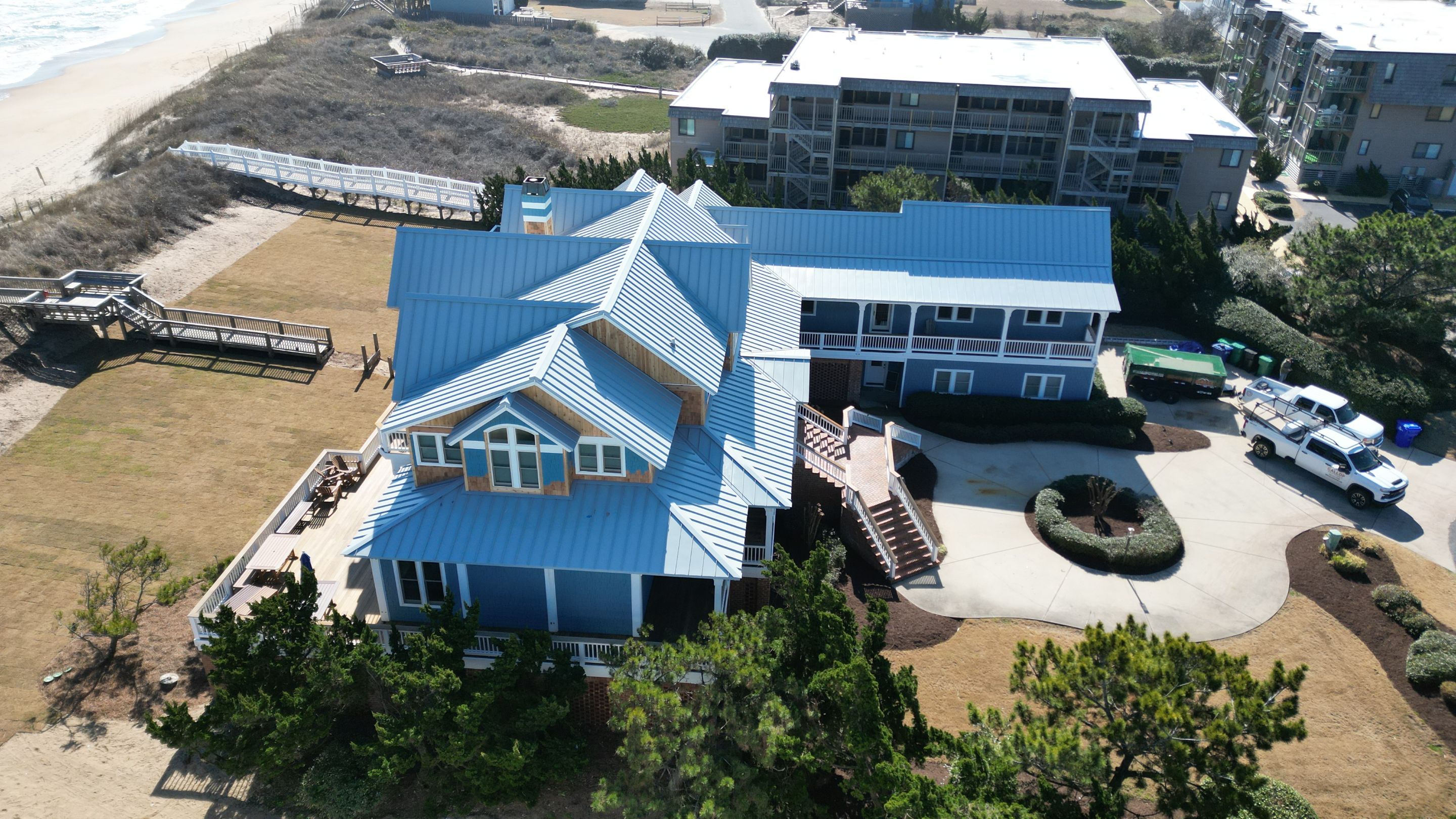 Large Metal Roof Transformation by Gallop Roofing & Remodeling, Inc.