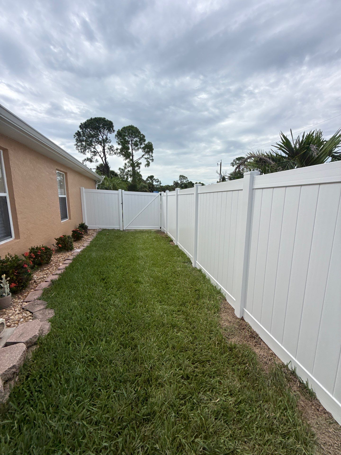 White Vinyl Privacy Fence Installation in North Port Florida by True Fence LLC