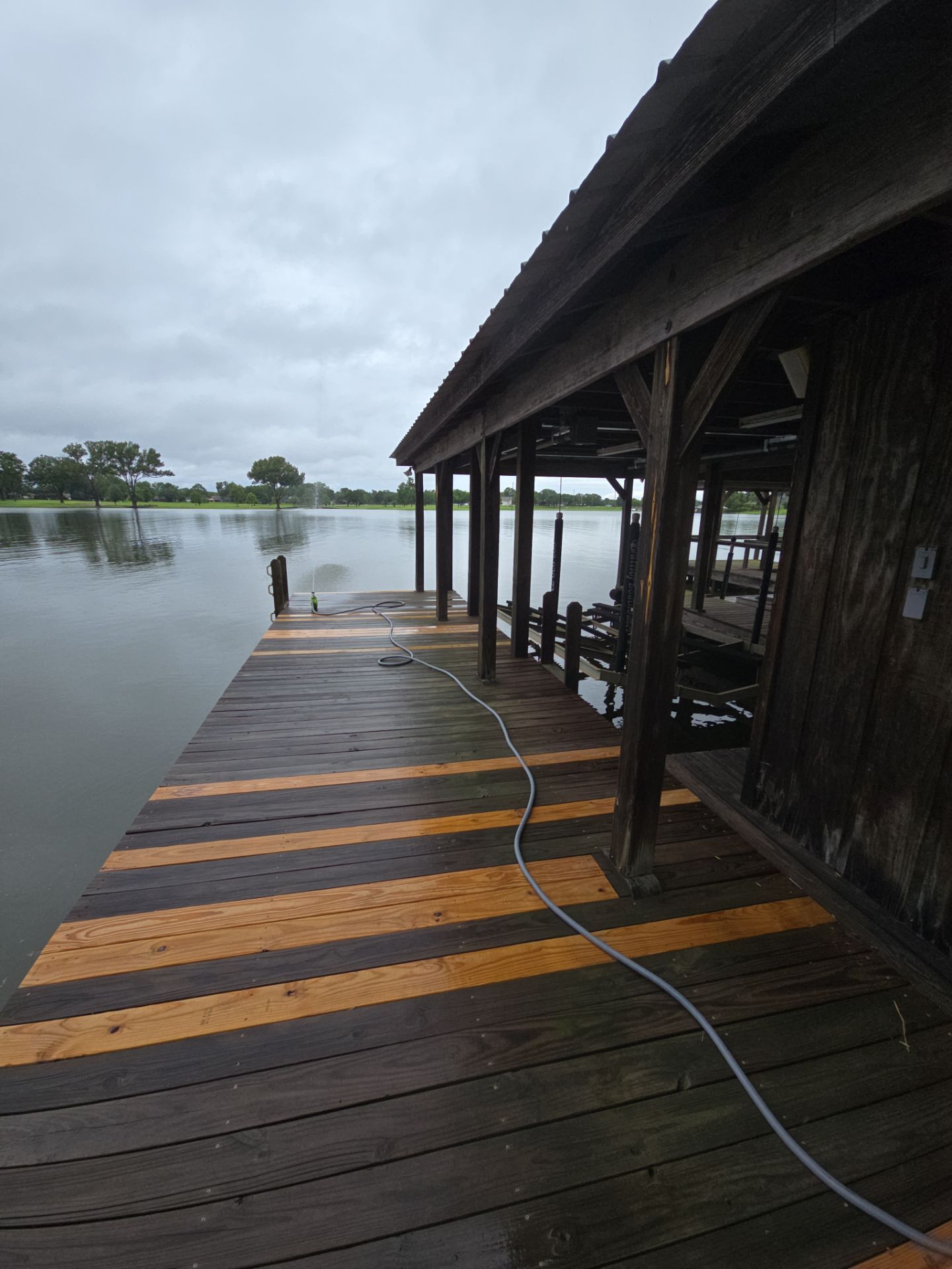 Lake House Deck Restaining in Flint, Texas by Quality Coats Painting