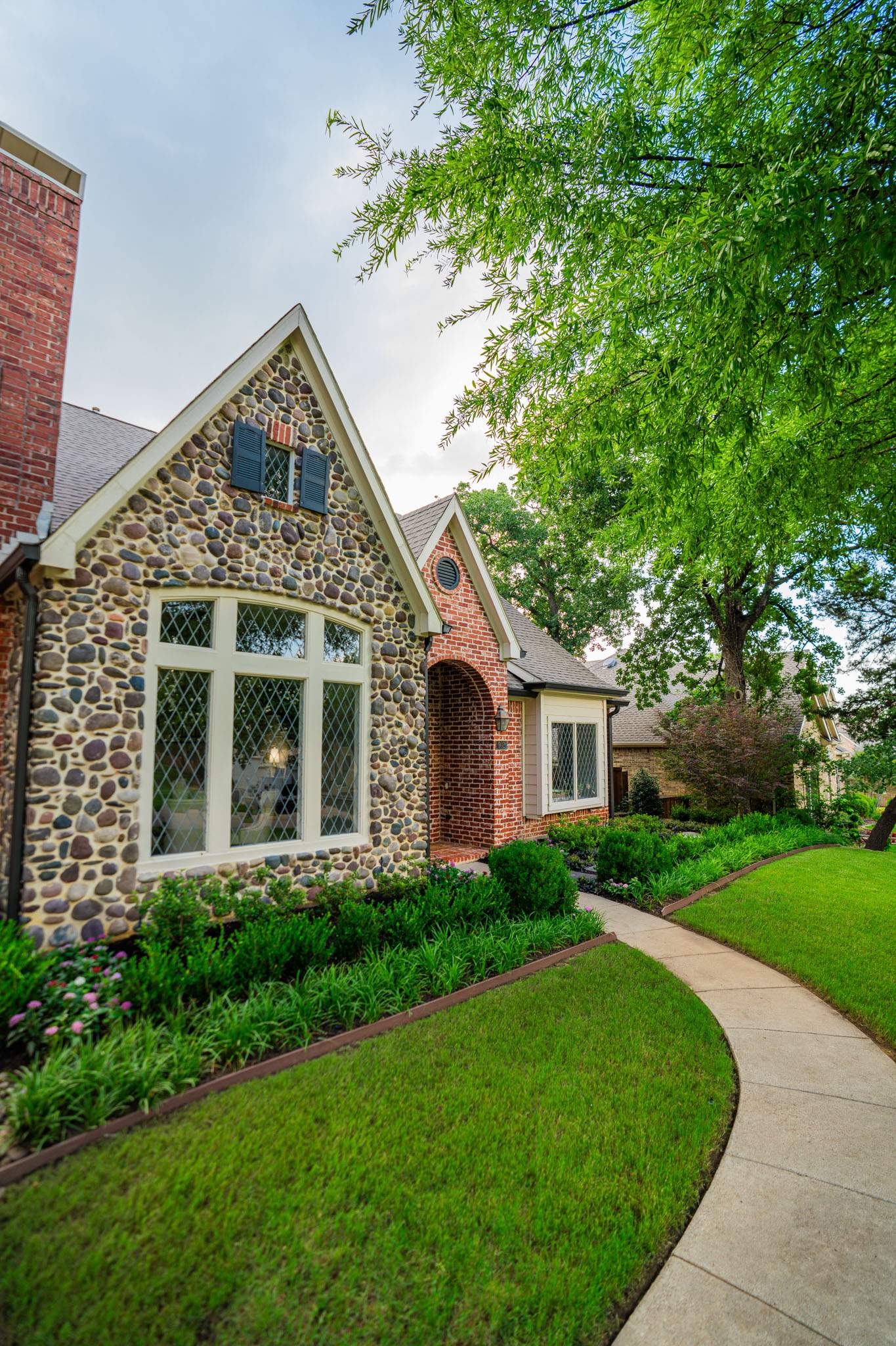 Southern Charm: Revitalizing a Cottage Garden by Complete Exterior Solutions