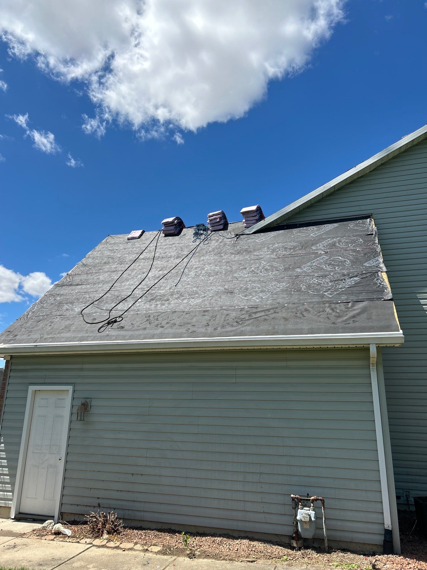 Exterior Installation using Onyx Black Durations and White Siding by WIW Enterprises Inc