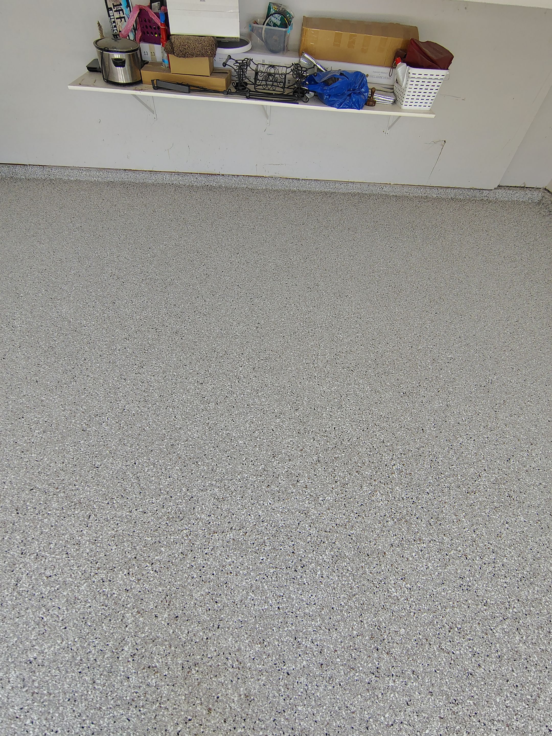 Decorative Chip Epoxy Garage Floor Coating in Sioux Falls by Select Painting, Coatings & Garage Cabinets