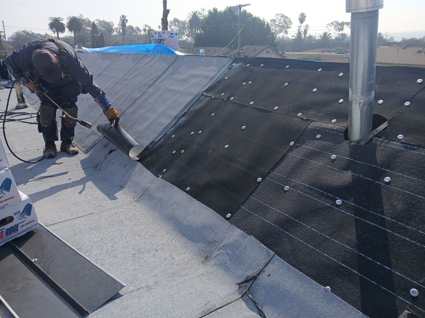 Apartment Building Roofing Installation using CertainTeed GTA Modified Bitument System by Hull Brothers Roofing