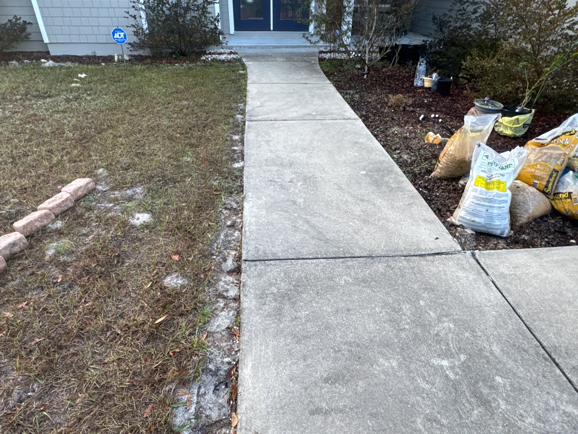 Patio and Sidewalk in Fort White, FL (Patio in Mediterranean, Sidewalk in Claystone Custom Hybrid) by Cross Creek Concrete Coatings
