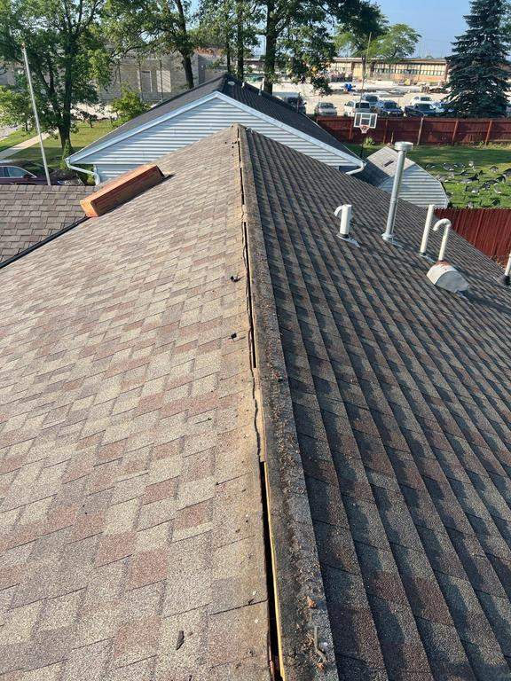Residential Roofing Repair using Ridge vent replacement by Nitro Roofing and Construction