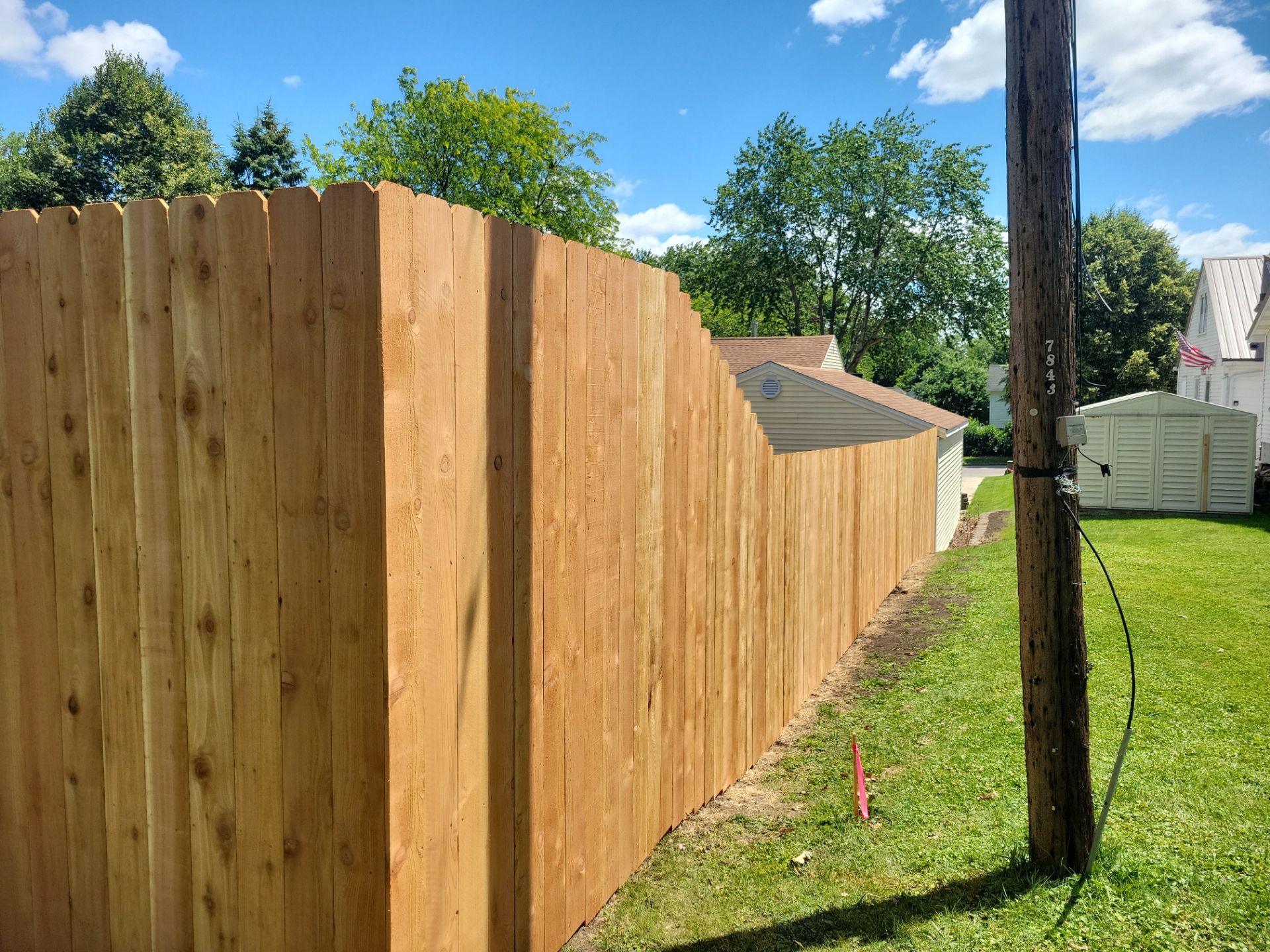 Custom Cedar Unstained Wood Privacy Fence Installation in Cedar Falls by Perfect Picket Fence and Stain
