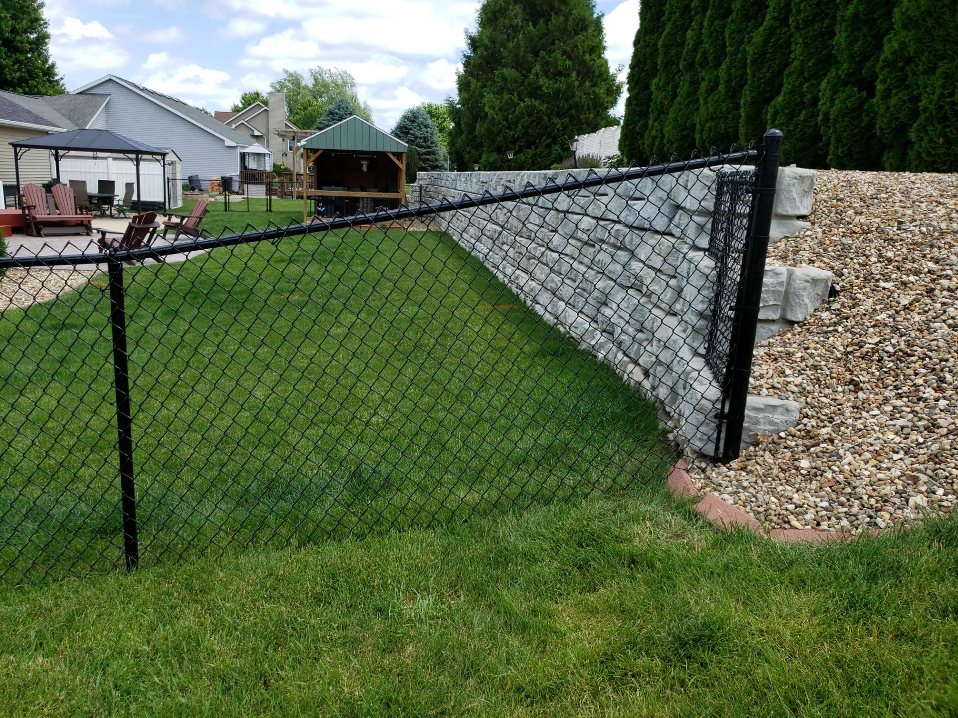 Black Vinyl-Coated Chain Link Fence Installation in Denver by Perfect Picket Fence and Stain