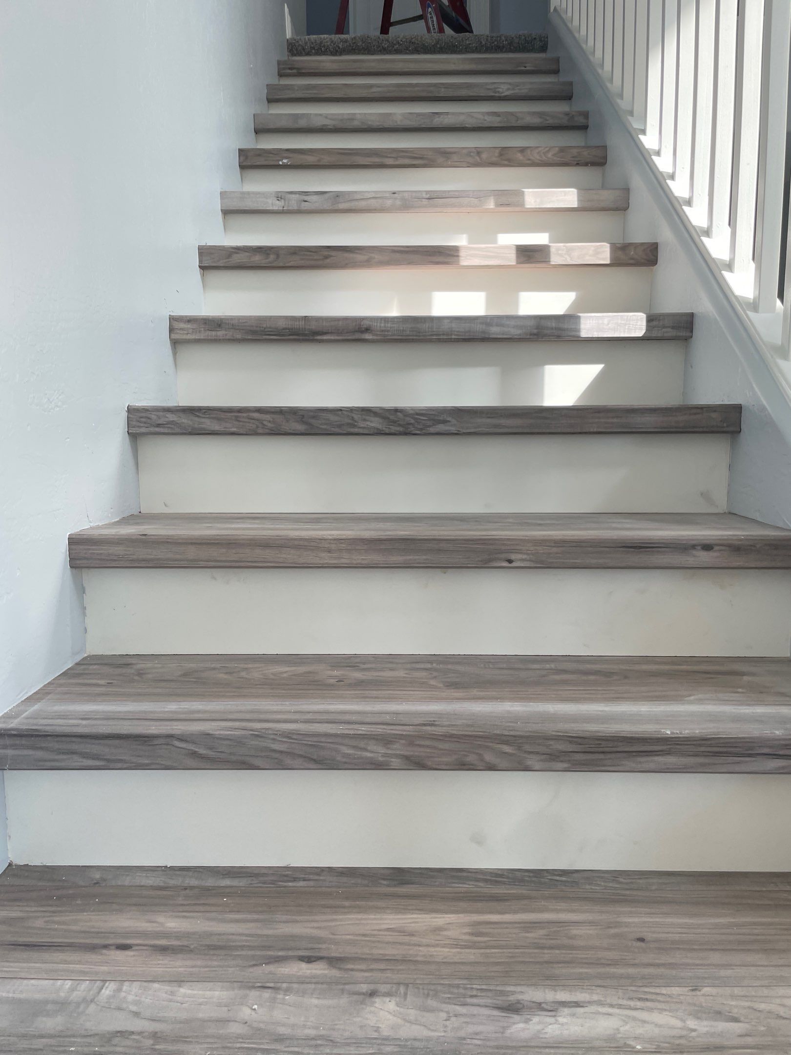 Laminate Staircase and Flooring  by Footprints Floors of Chandler 