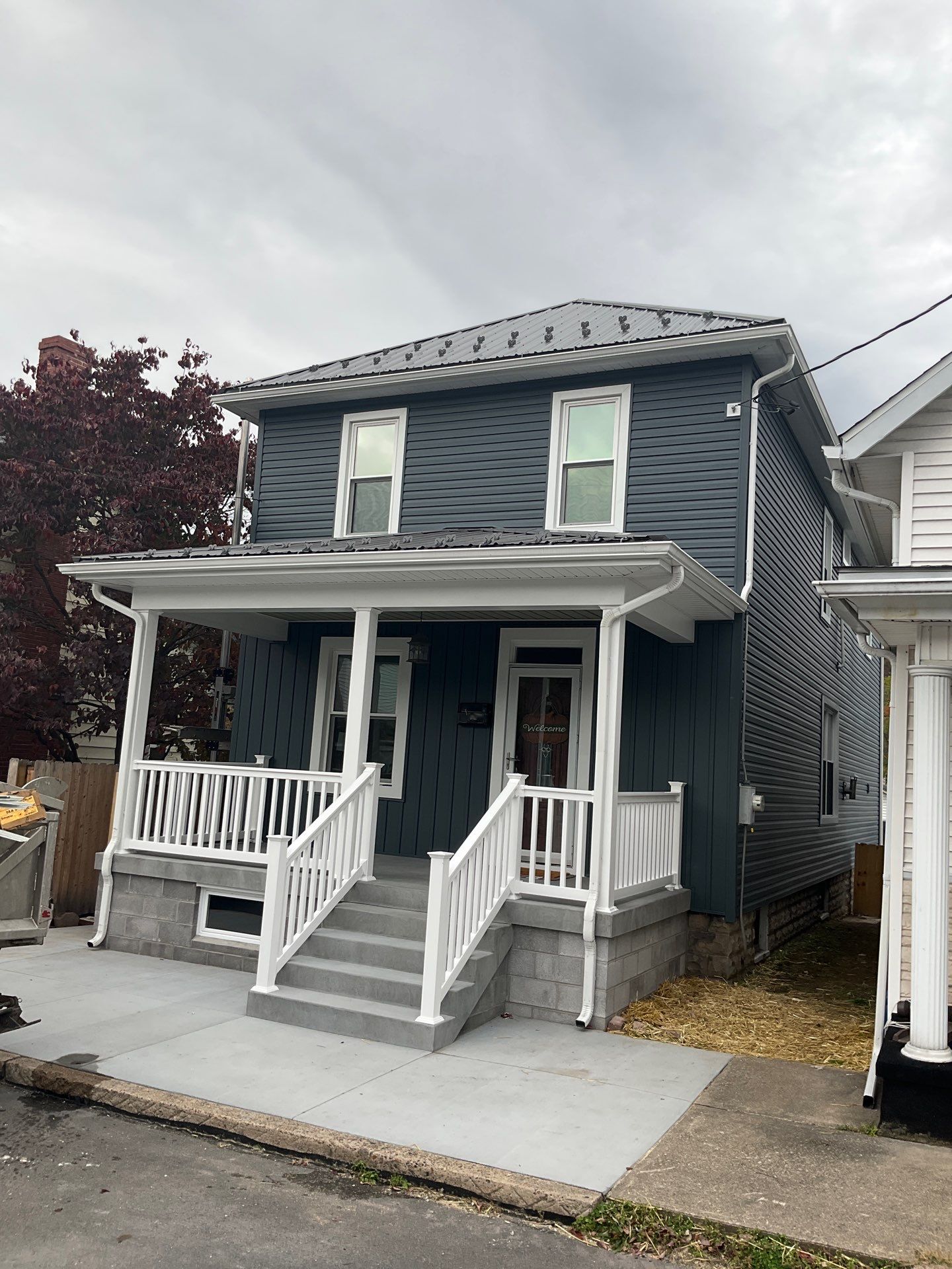 Charcoal Metal Roof & Blue Siding — A Refreshing New Look by Esh Builders