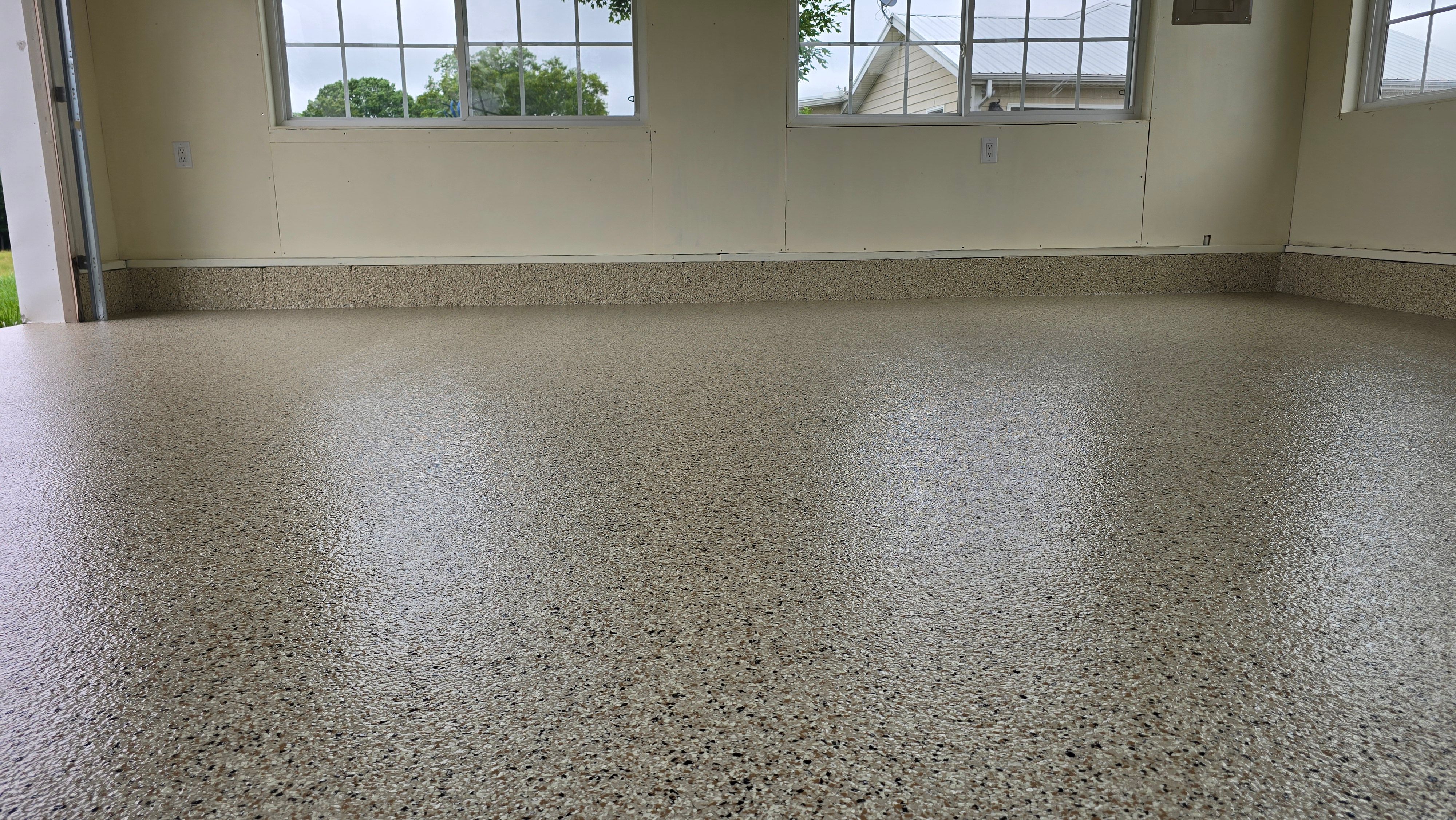 Two garages completed using Shoreline and Midnight by Elite Floor Solutions