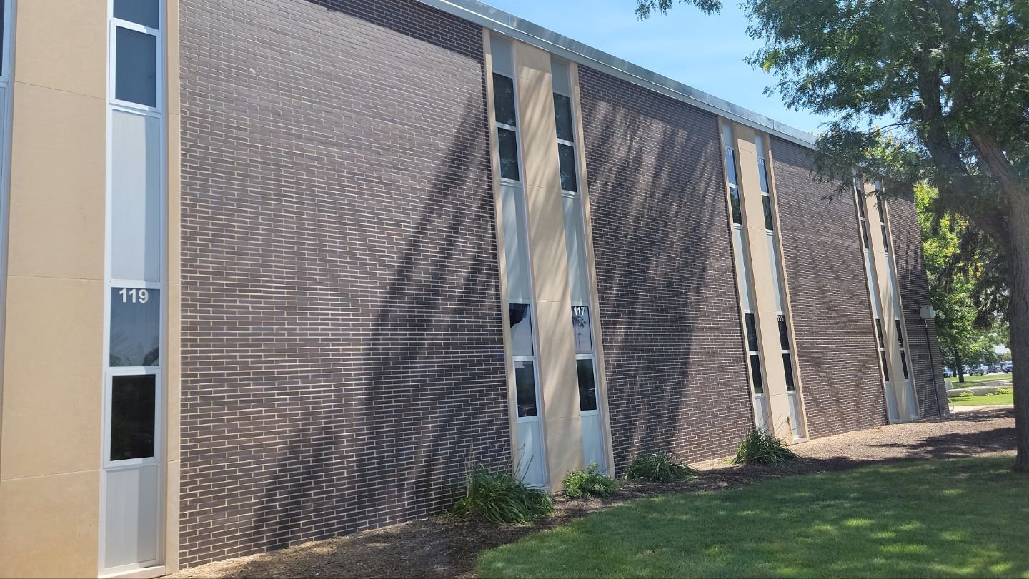 commercial pressure washing using Algaecide, soft wash soap by Northern Power Washing LLC.