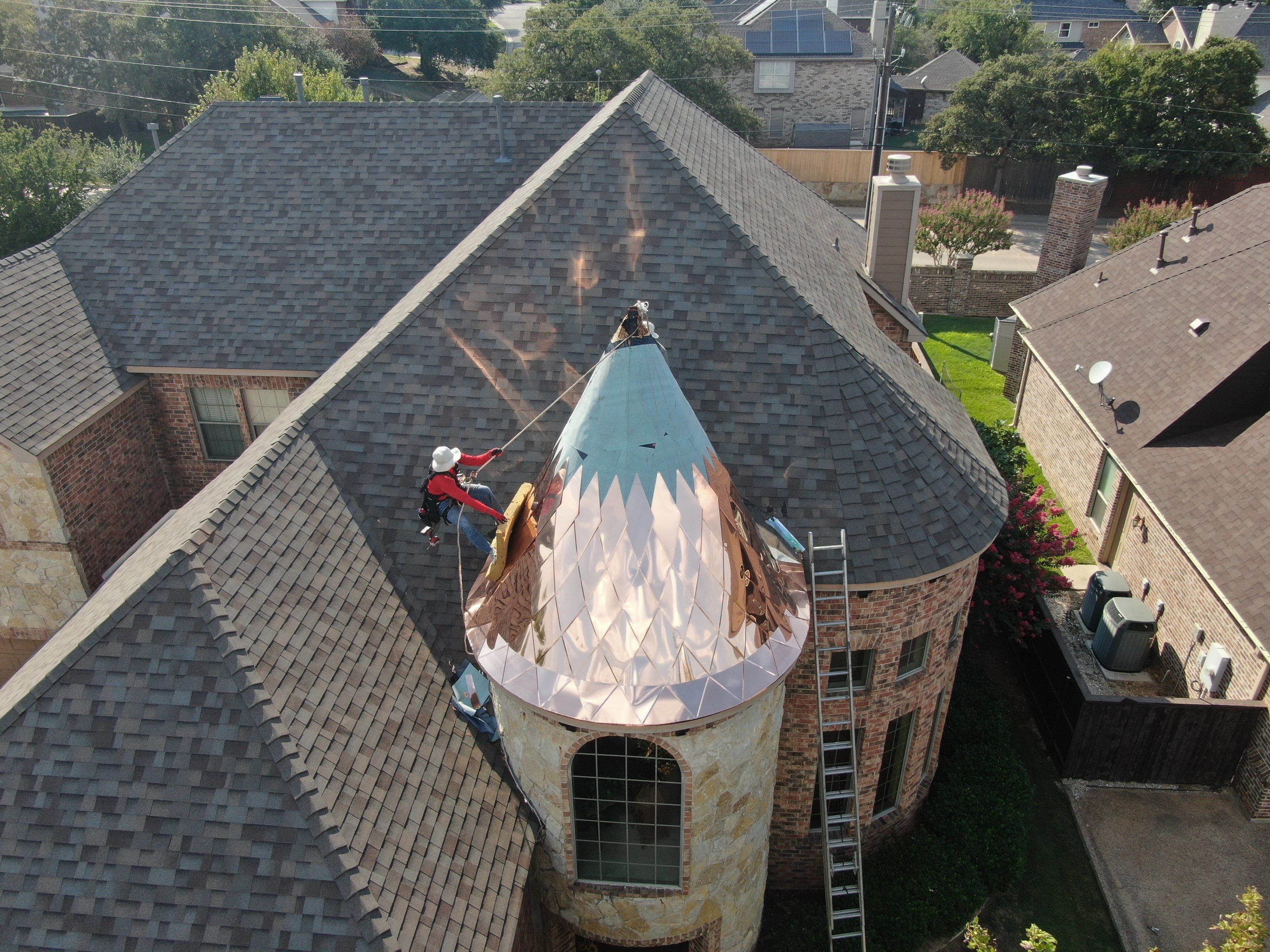 Installing Custom copper turret and Malarkey Vista Class 4 shingles Hail Damage Upgrade by Becker Roofing and Exteriors