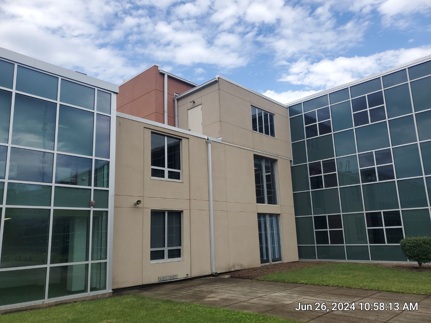 concrete using Algaecide, soft wash soap by Northern Power Washing LLC.