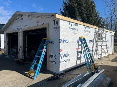 Green Metal Roof Installation and Exterior Renovation in Thornville by Canopy Contracting
