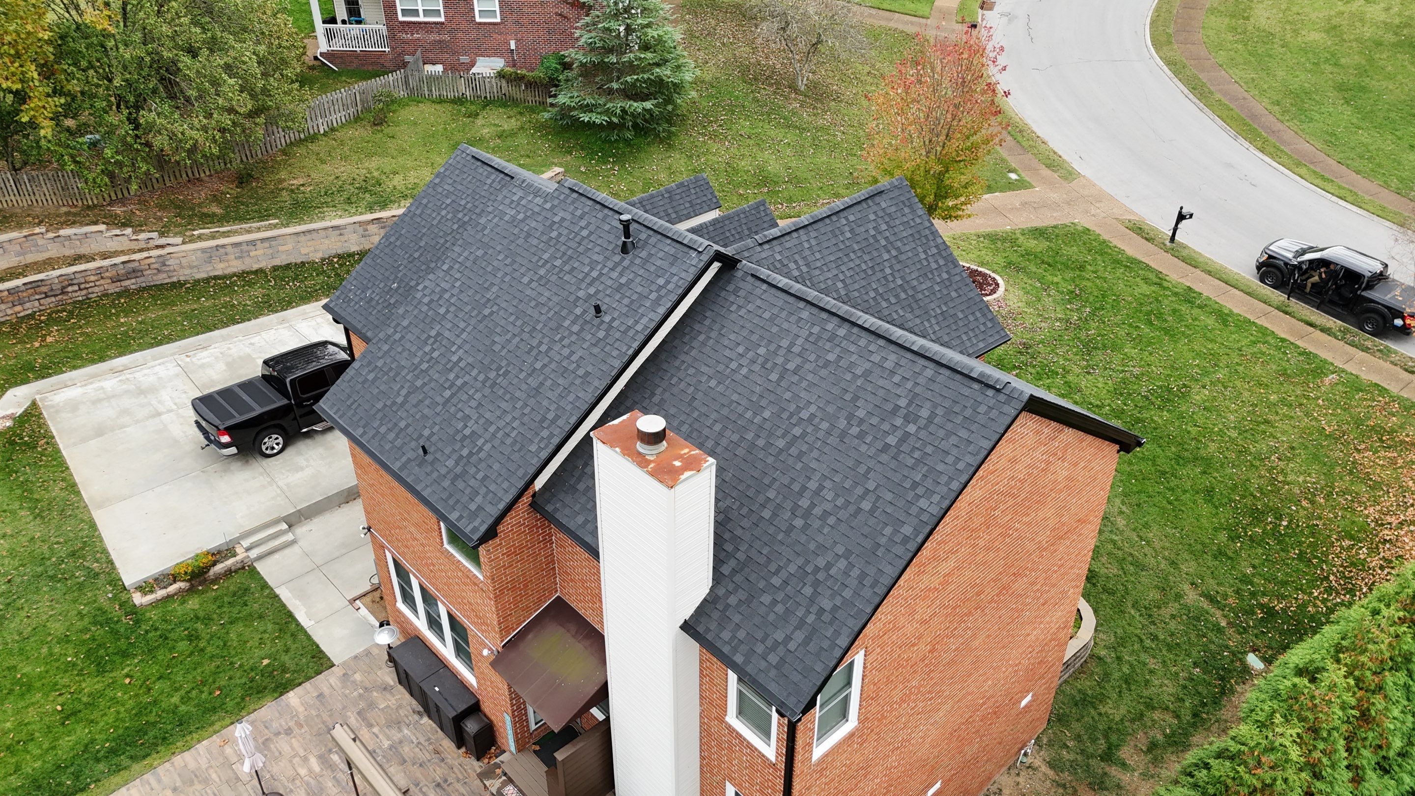 Charcoal Black Re-Roof & Gutters by Royal House LLC