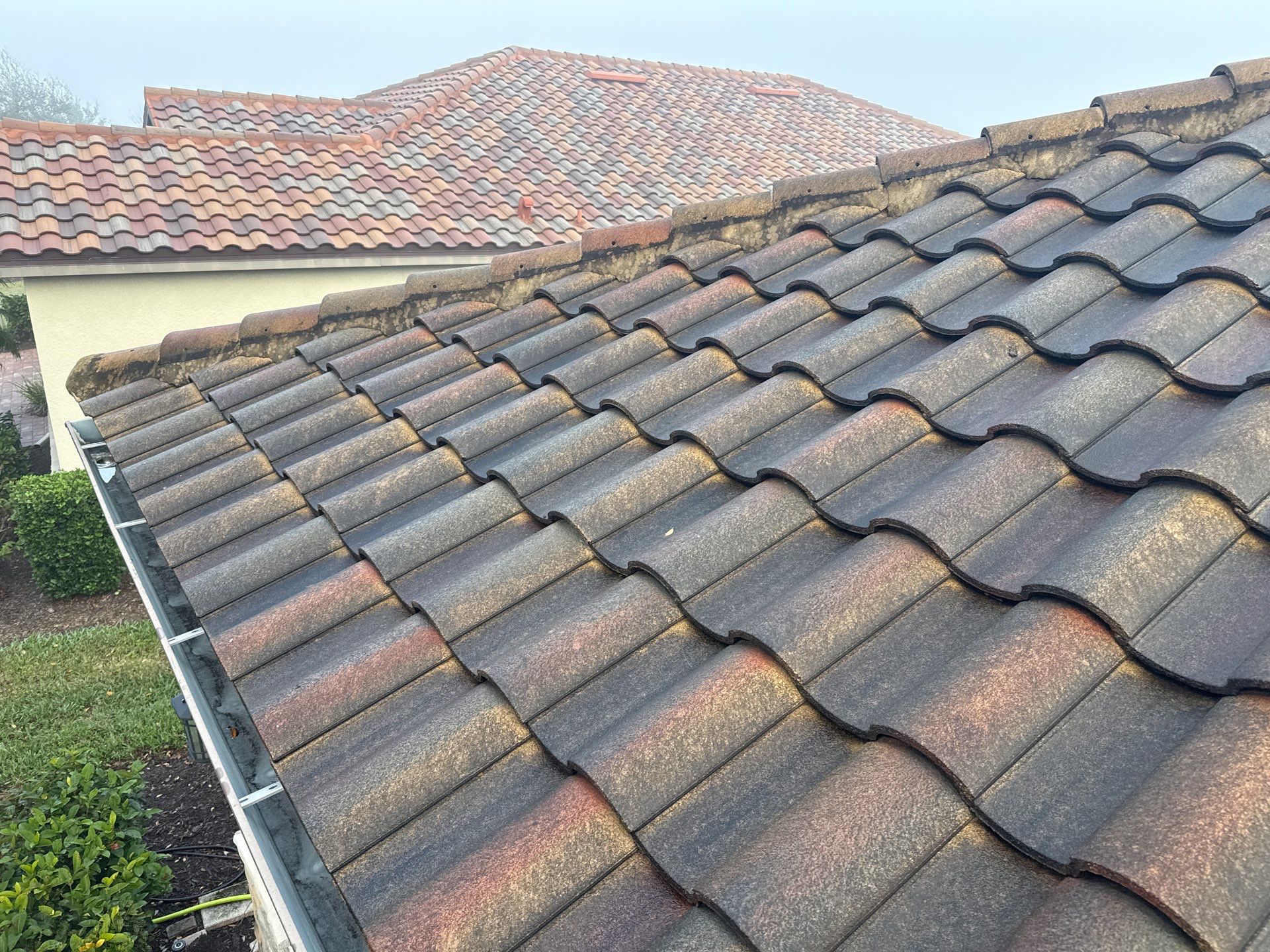 Barrel Tile Roof Cleaning & Paver Driveway Cleaning in River Strand at Heritage Harbour | Bradenton, FL by Sunshine AquaWash
