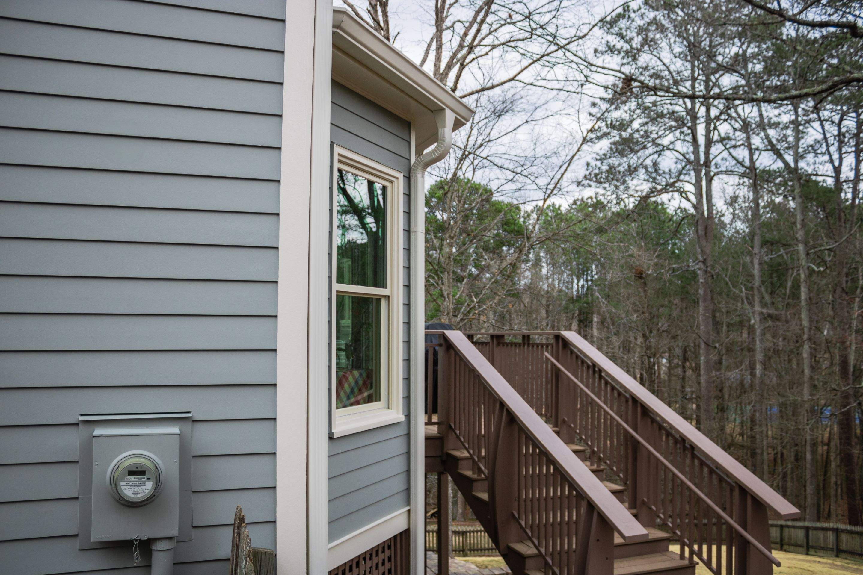 James Hardie Siding Replacement, Exterior Painting, Deck Stain, and Gutter Installation in Peachtree Corners, GA by Nelson Exteriors 