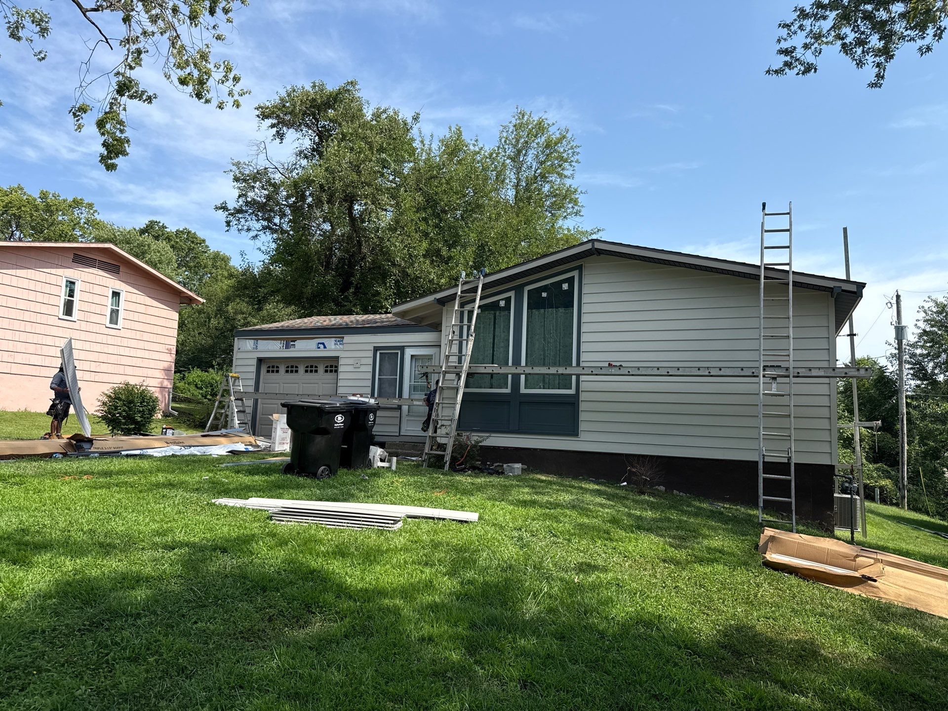 Complete Exterior Transformation With Craneboard Siding and Heartland Windows by EEC Windows, Siding & Roofing