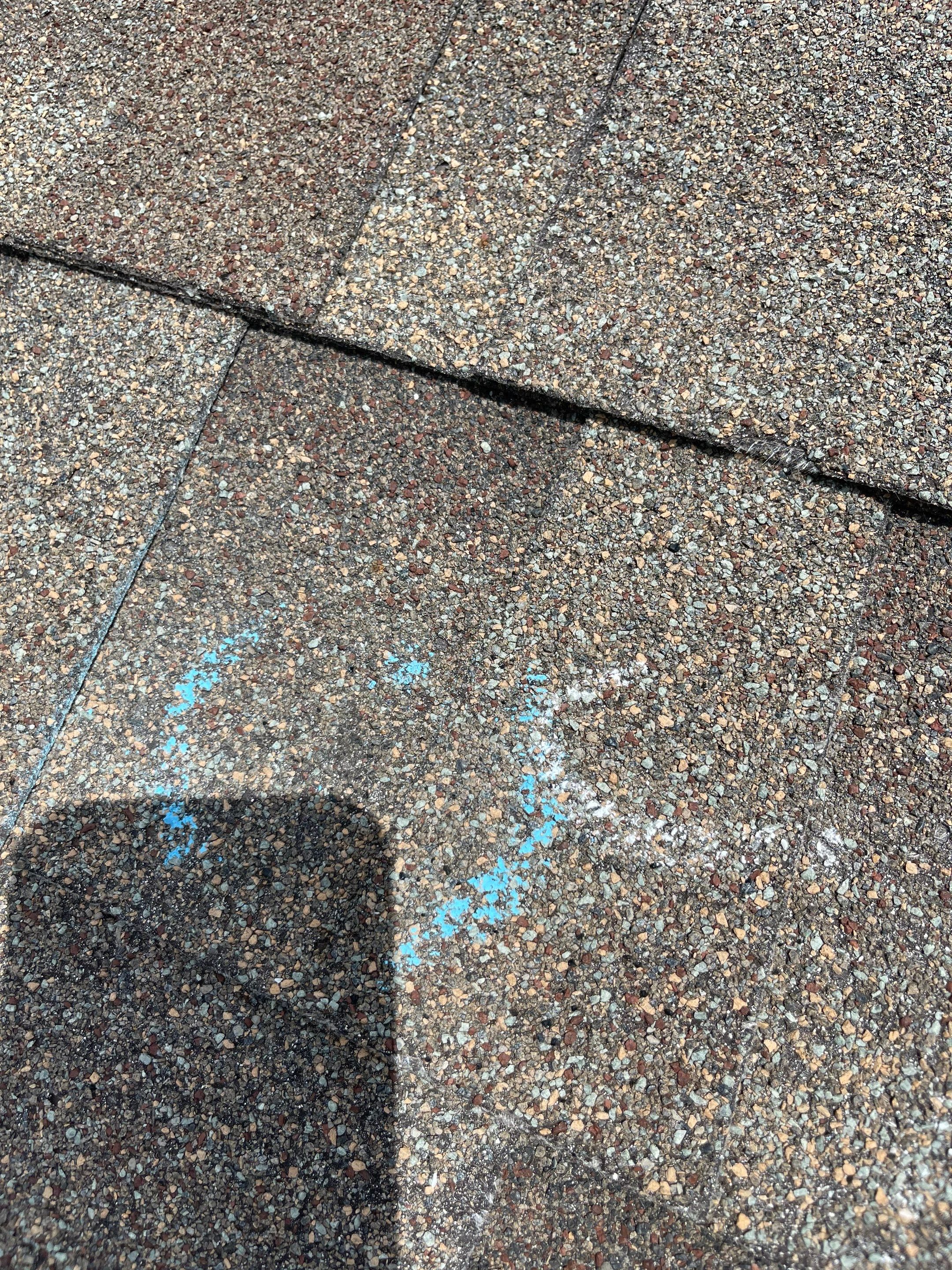 Hail Damage on a Roofing System by Icon Roofing And Construction 