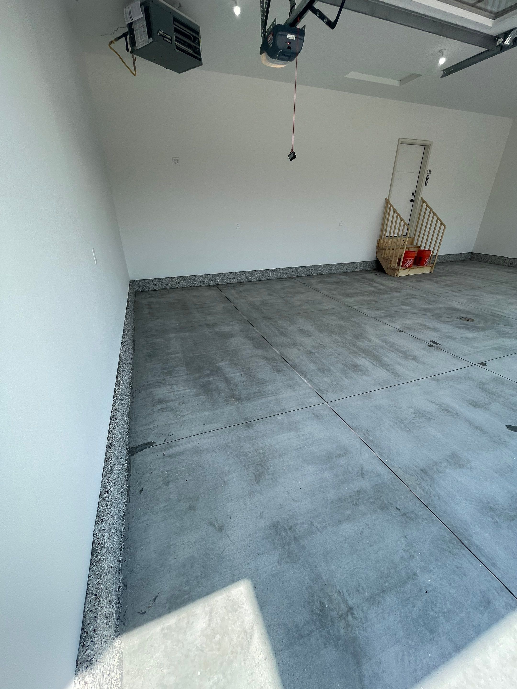 Grey Speckled Garage Floor Coating in Sioux Falls by Select Painting, Coatings & Garage Cabinets