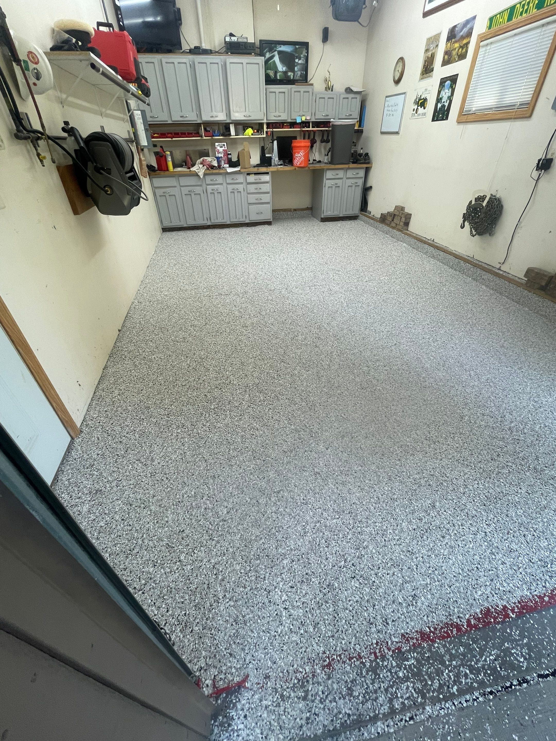 Multi-Stall Garage Floor Coating Installation in Sioux Falls by Select Painting, Coatings & Garage Cabinets