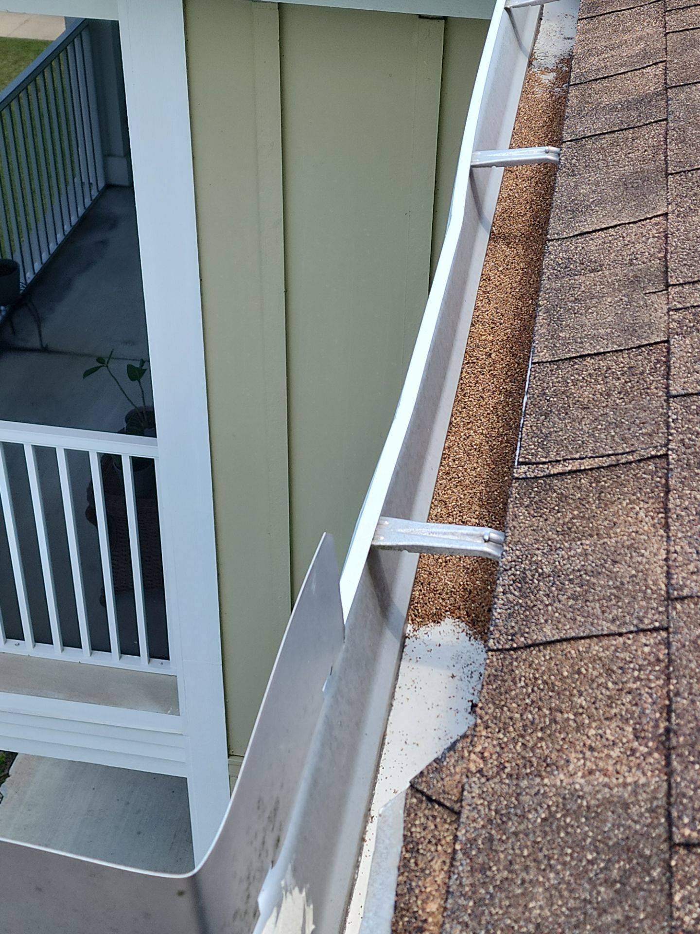 HOA gutter cleaning in Port Charlotte, FL,before photo showing full gutters.