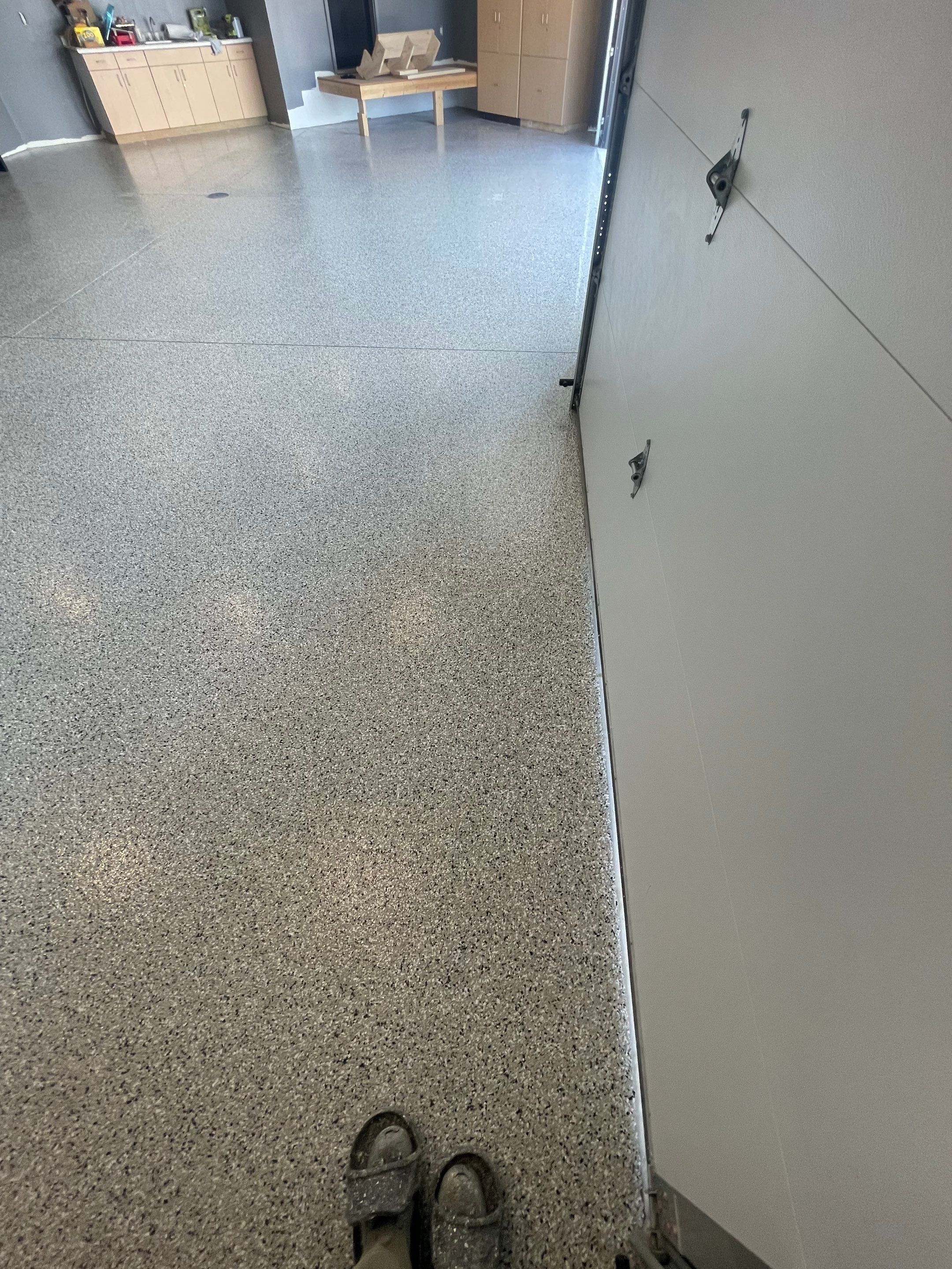 Custom Speckled Concrete Coating for Dell Rapids Garage by Select Painting, Coatings & Garage Cabinets